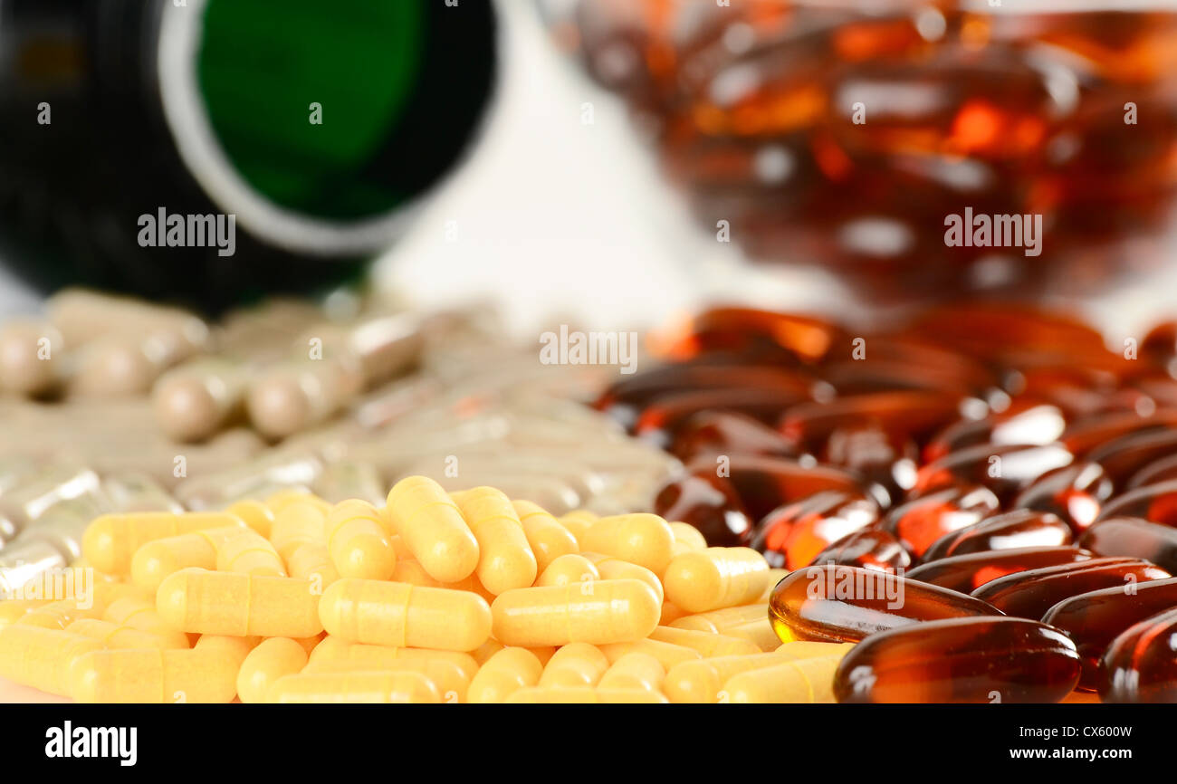 Composition with dietary supplement capsules and containers Stock Photo