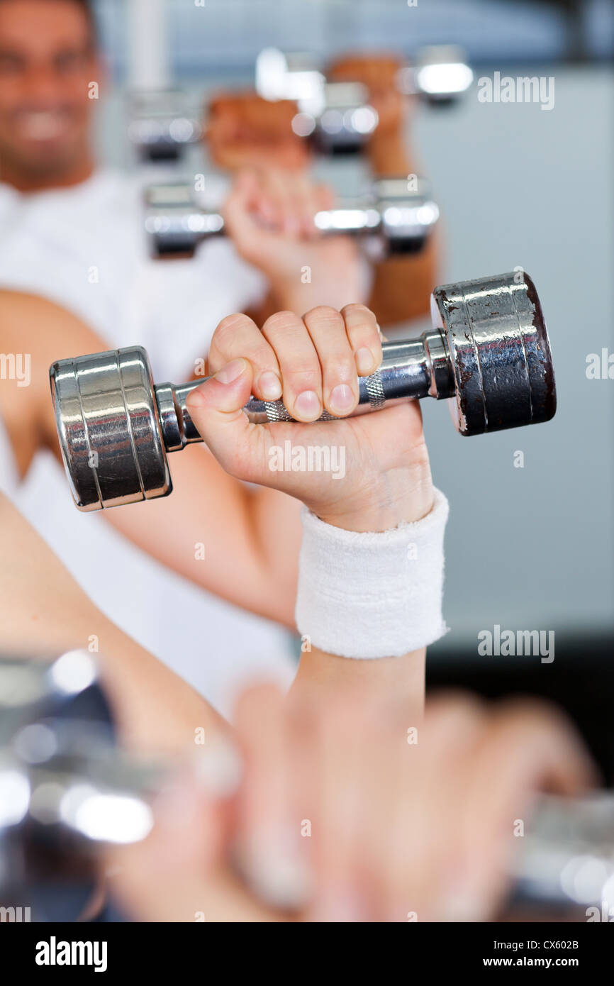 exercise with dumbbell in gym Stock Photo