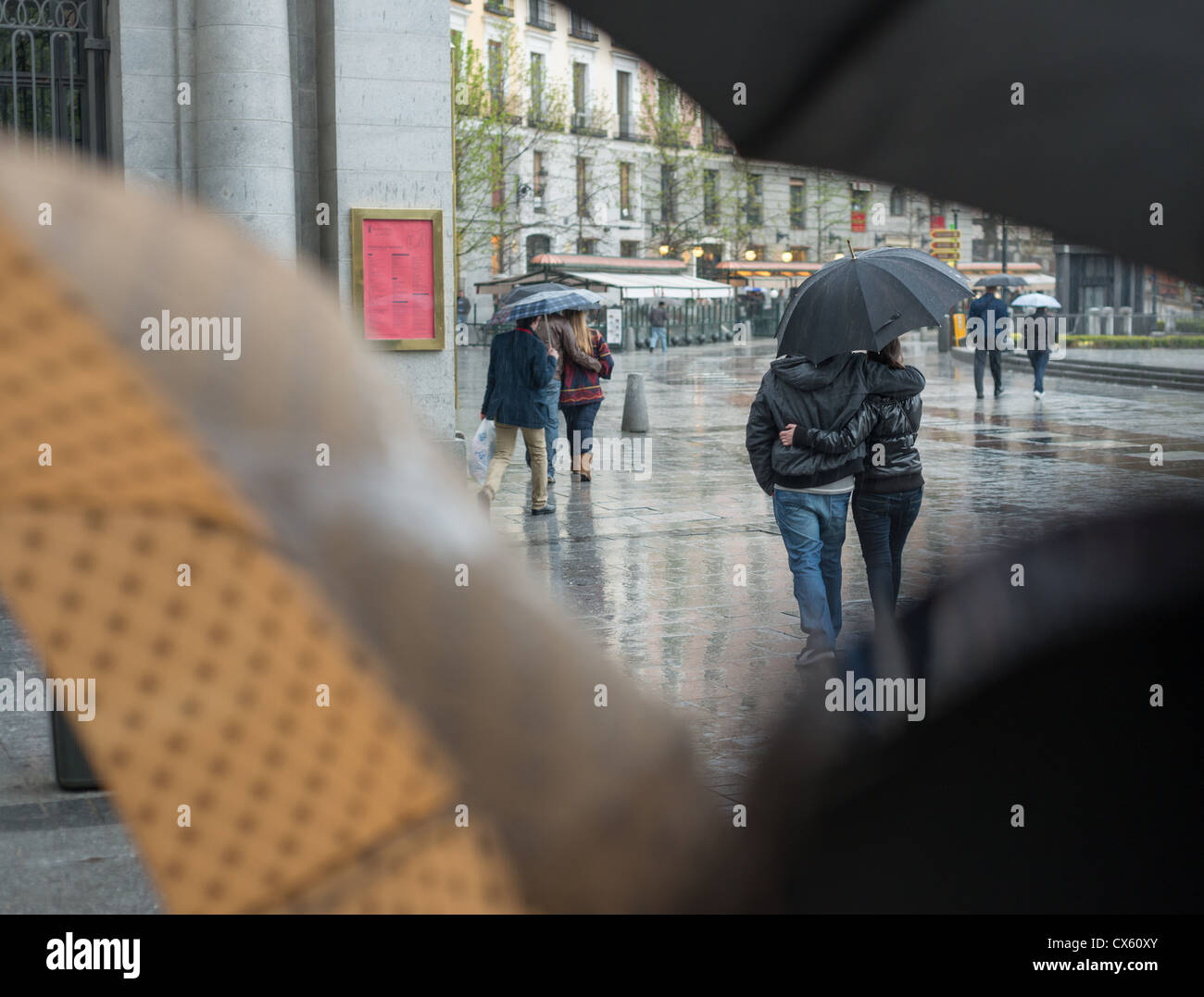 Couple walking in the rain Stock Photo
