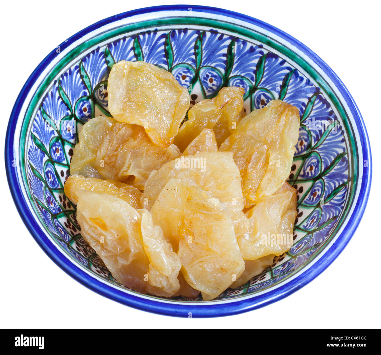 dried pears in traditional bowl isolated on white background Stock