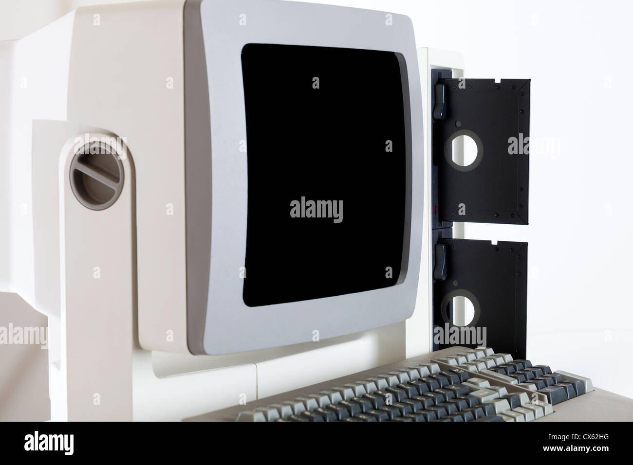 1980's PC desktop computer and monitor with 5 1/4 floppy disc drives