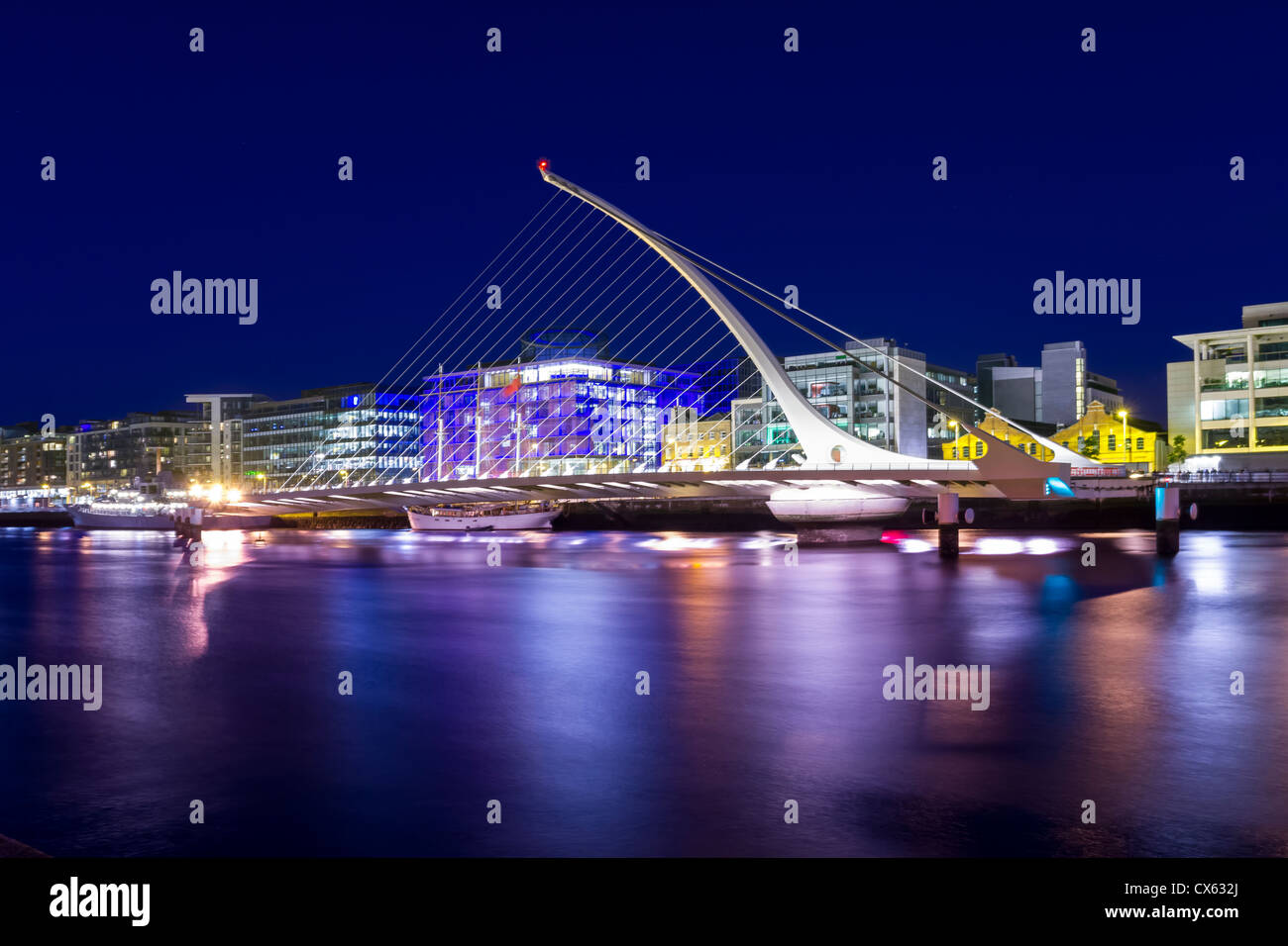 Samuel Beckett Bridge being open during the Tall Ship Race event. All trademarks and people have been removed. Stock Photo