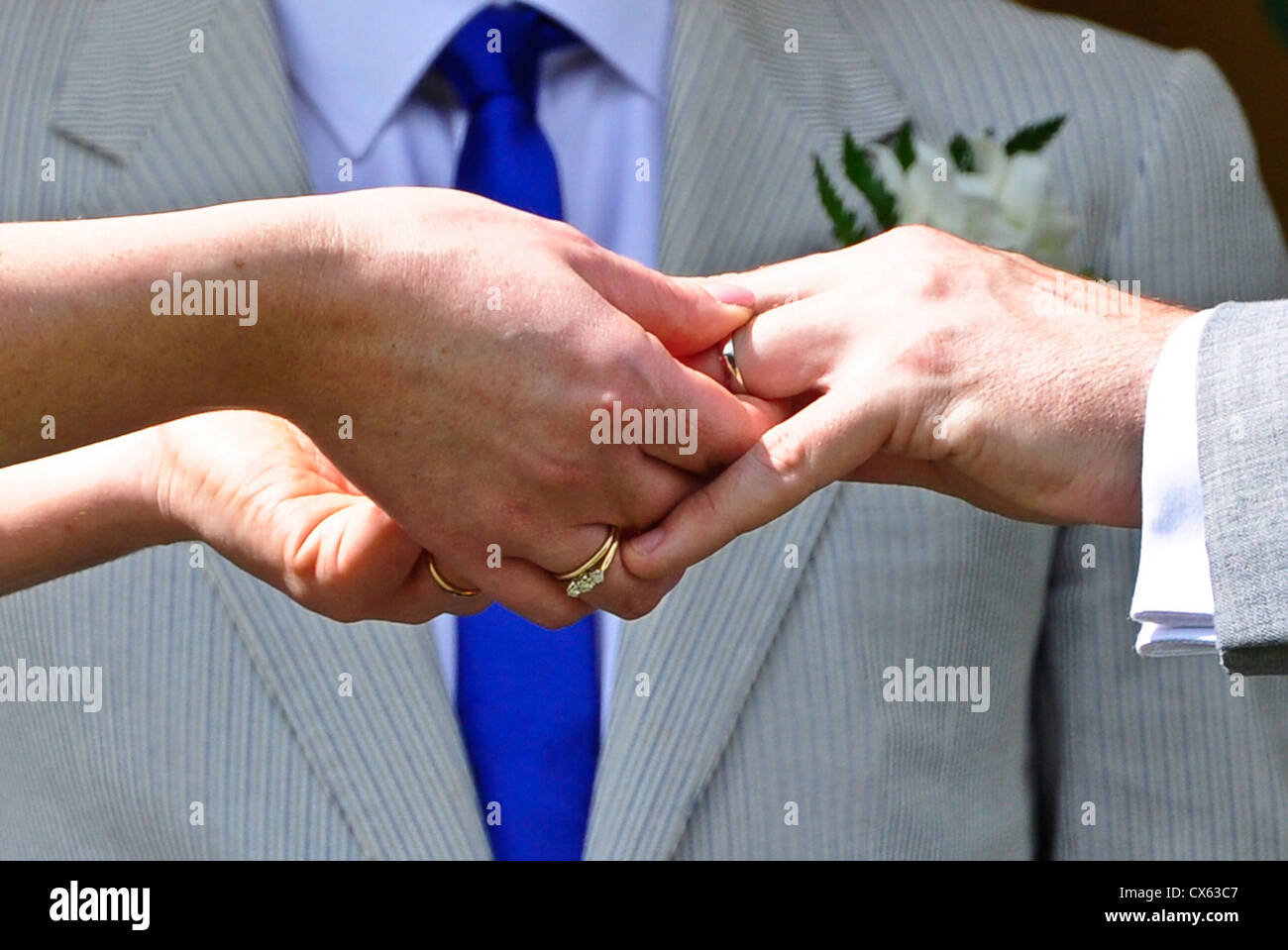 Wedding Rings being exchanged Stock Photo