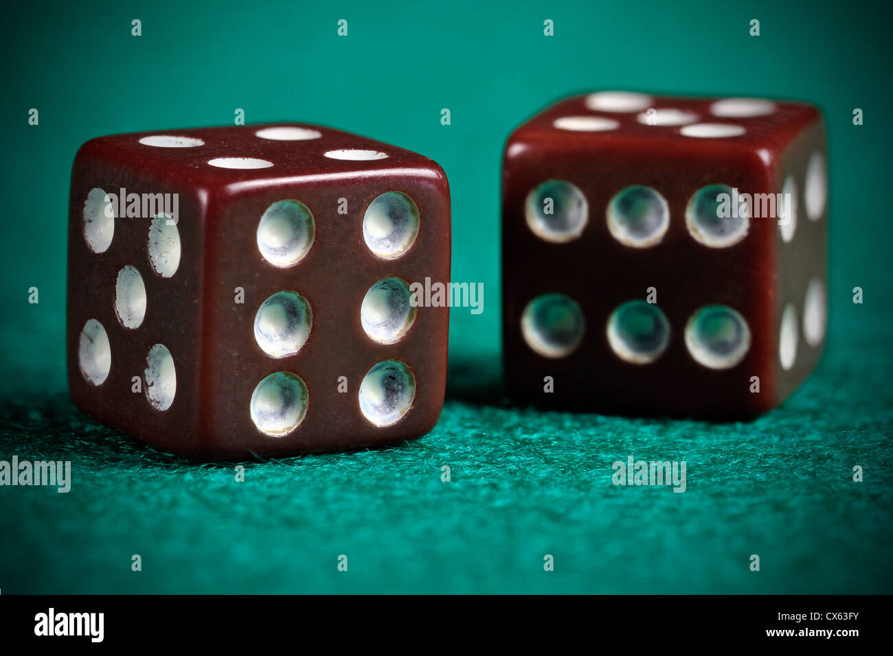 A pair of retro looking worn out dices Stock Photo
