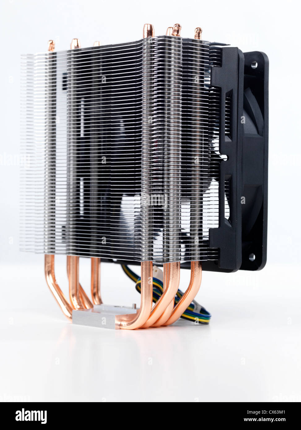 Closeup of computer processor cooler with a heat sink and a fan isolated on white background Stock Photo