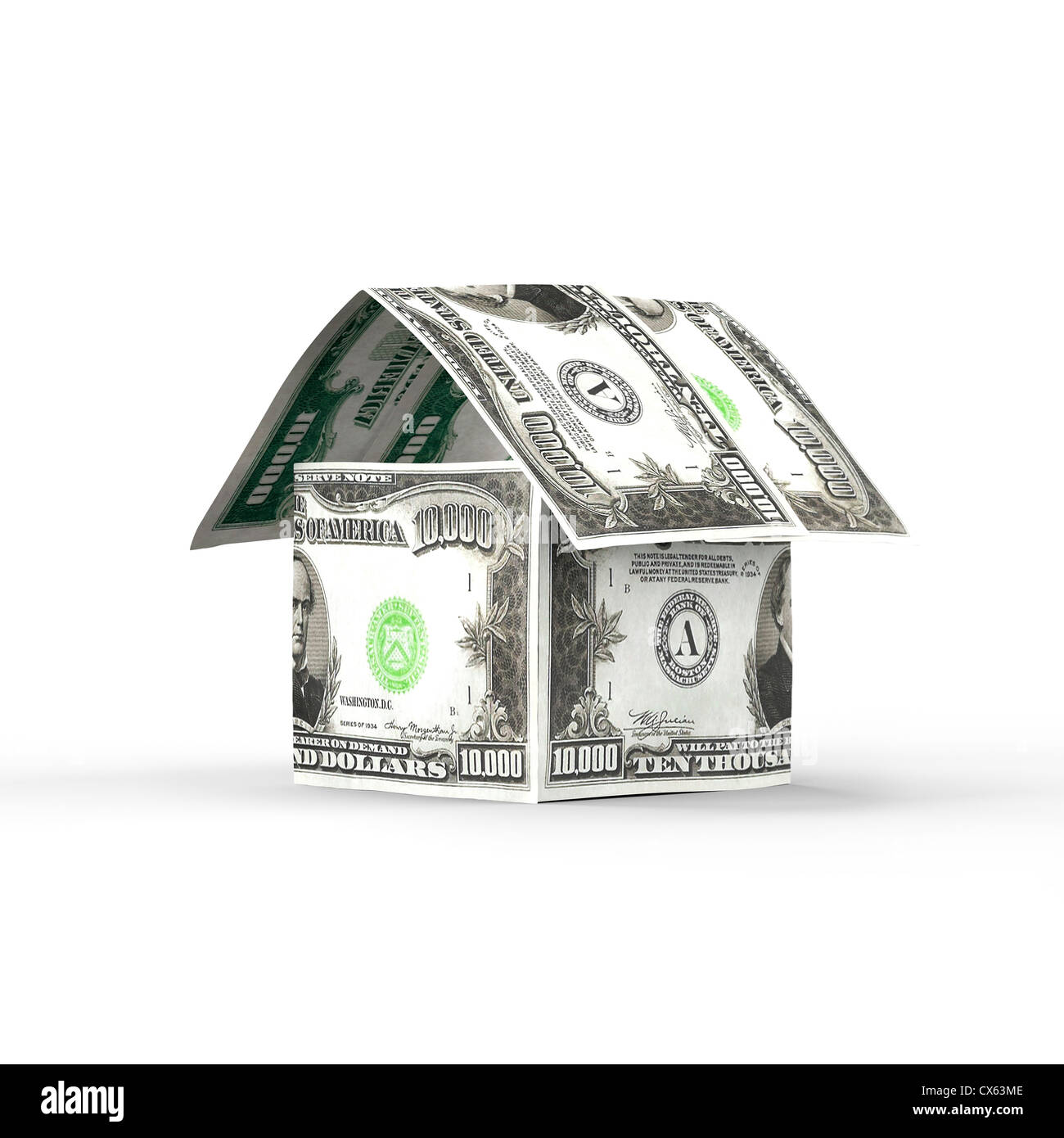 House made of money, ten thousand US dollar bills isolated on white background. Housing, property, mortgage, renovation concept. Stock Photo