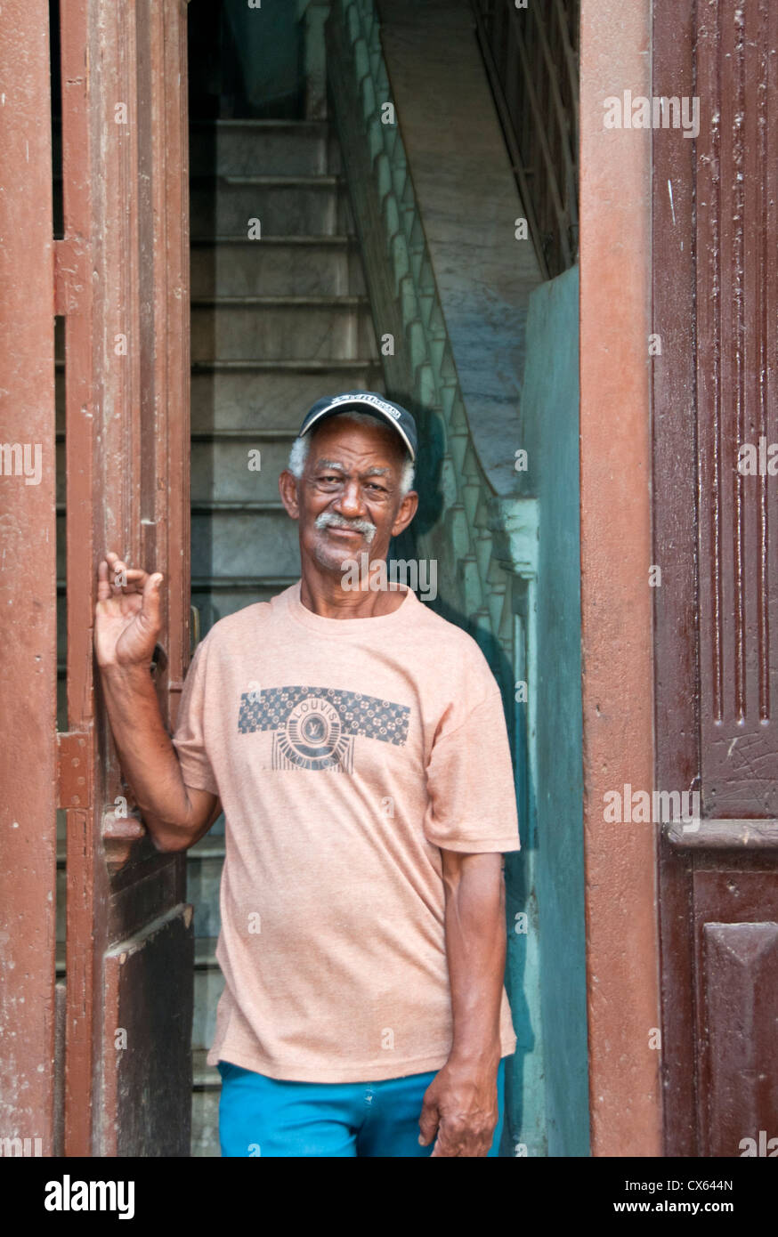 Local Cuban Man at Front Door, Calle Brazil, Habana Vieja, Havana, Cuba, Caribbean Stock Photo