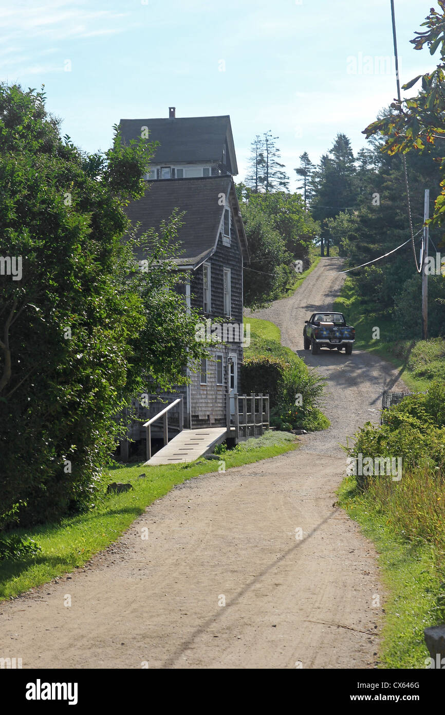 A truck climbs a hill on Monhegan Island, Maine Stock Photo