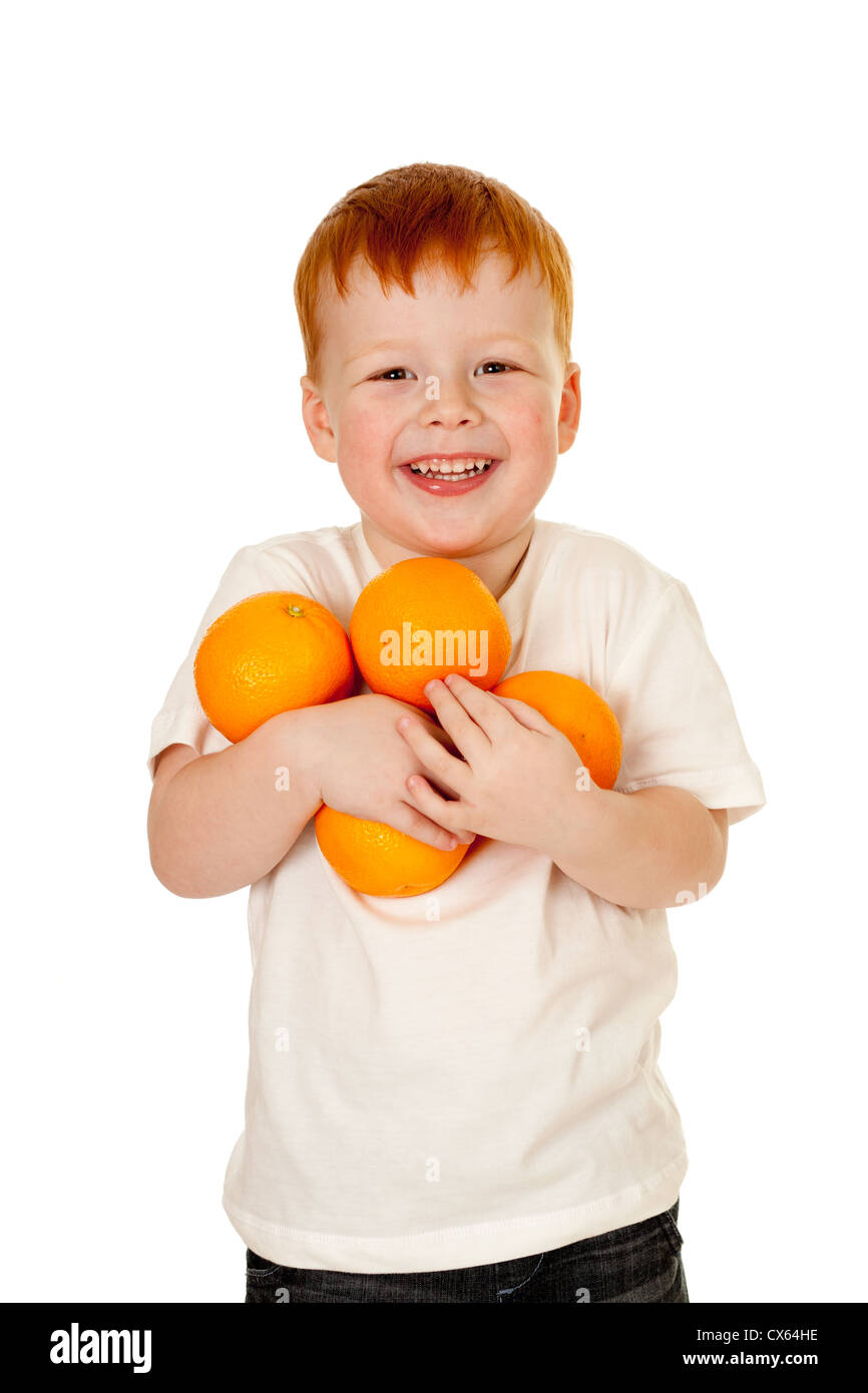 child, boy with oranges. healthy lifestyle concept. Stock Photo