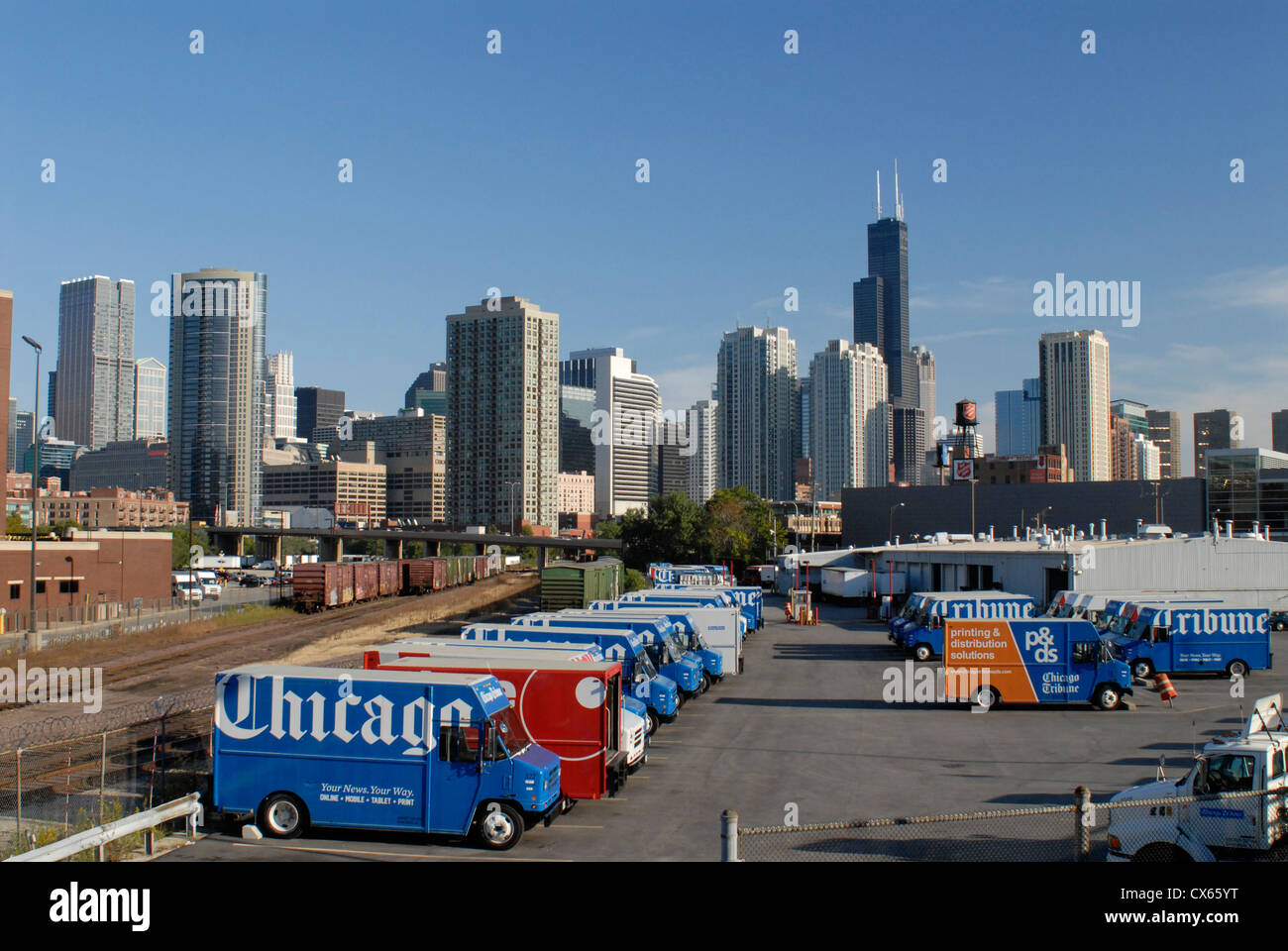 Chicago Tribune newspaper trucks and Chicago skyline, Illinois. The