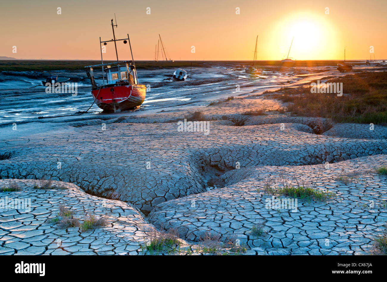 Mud Flats & Fishing Boats at Sunset, Heswall, The Dee Estuary, The Wirral, Merseyside, England, UK Stock Photo