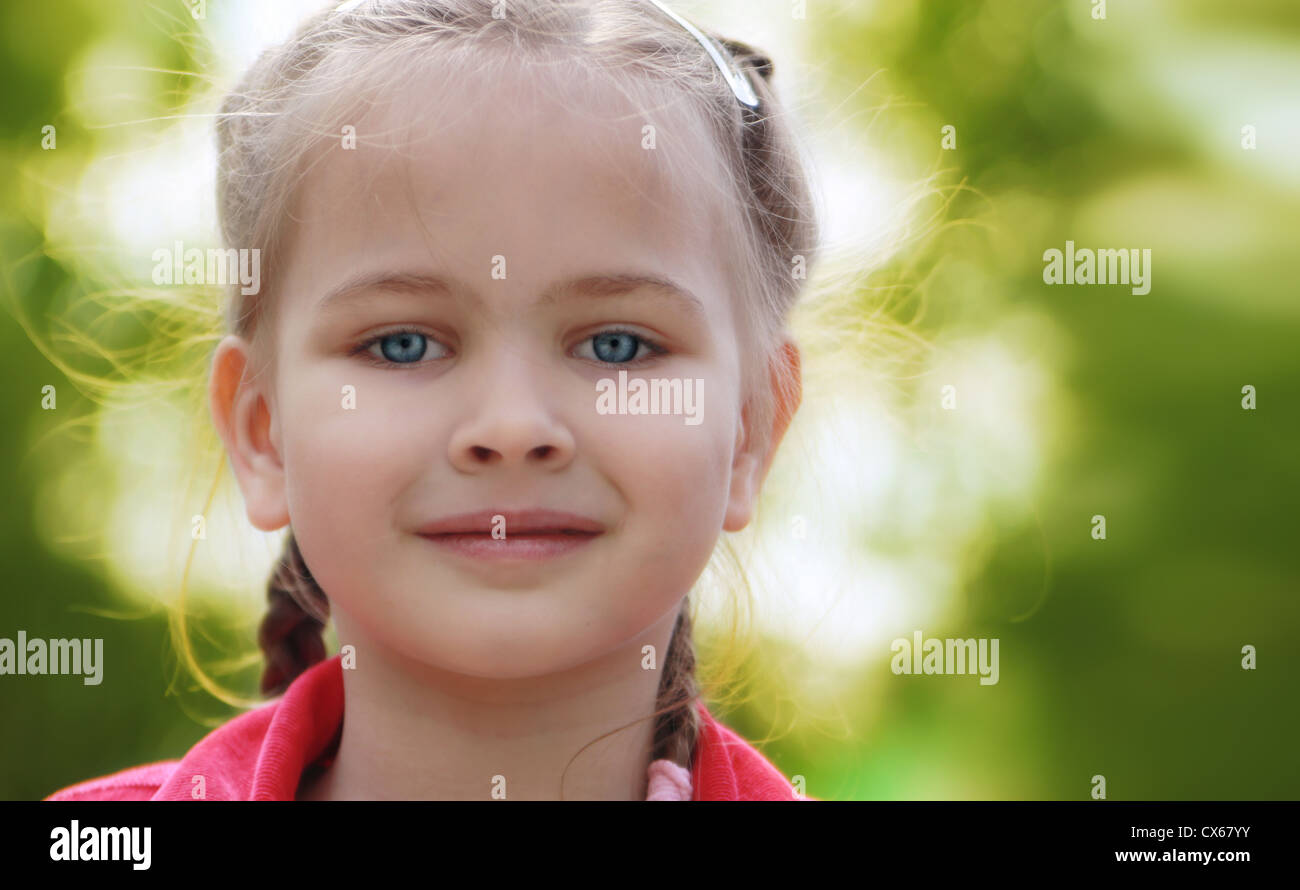 Portrait Of A Smiling Beautiful Little Girl Outdoors In Summer Day ...