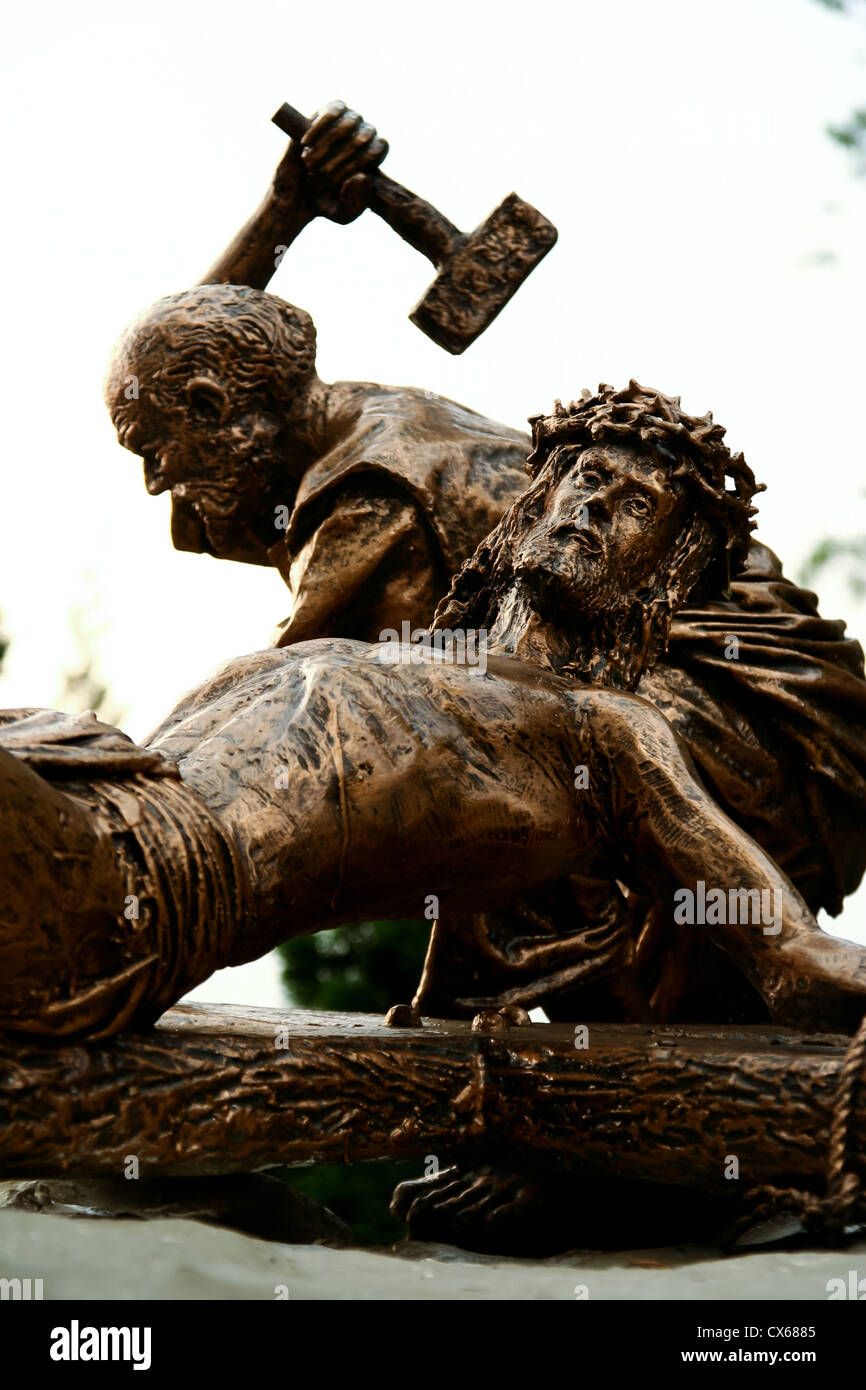 Sculpture depicting the crucifixion of Jesus on the cross. Stock Photo