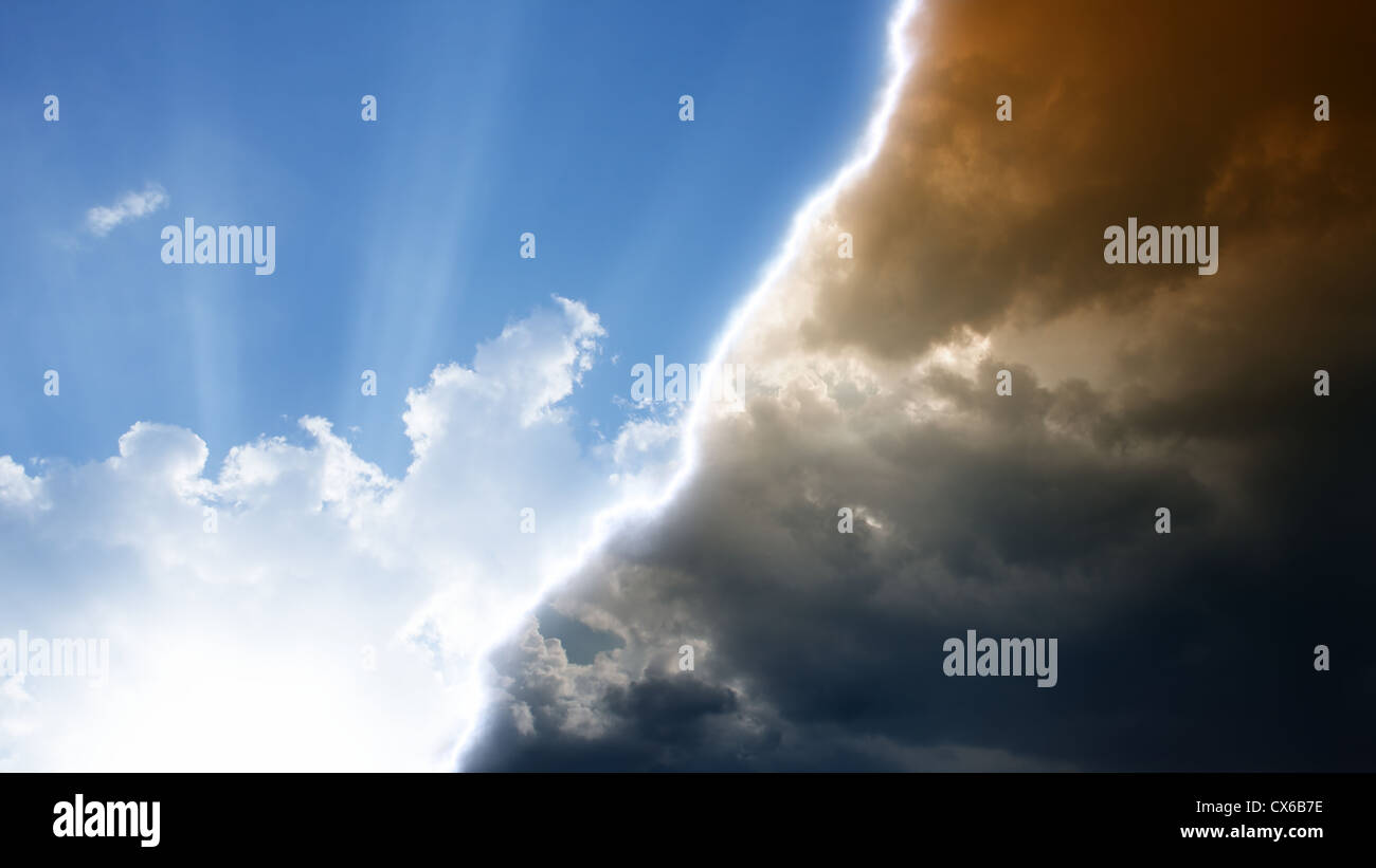 Dark red and bright blue sky, heaven and hell, good vs evil Stock Photo