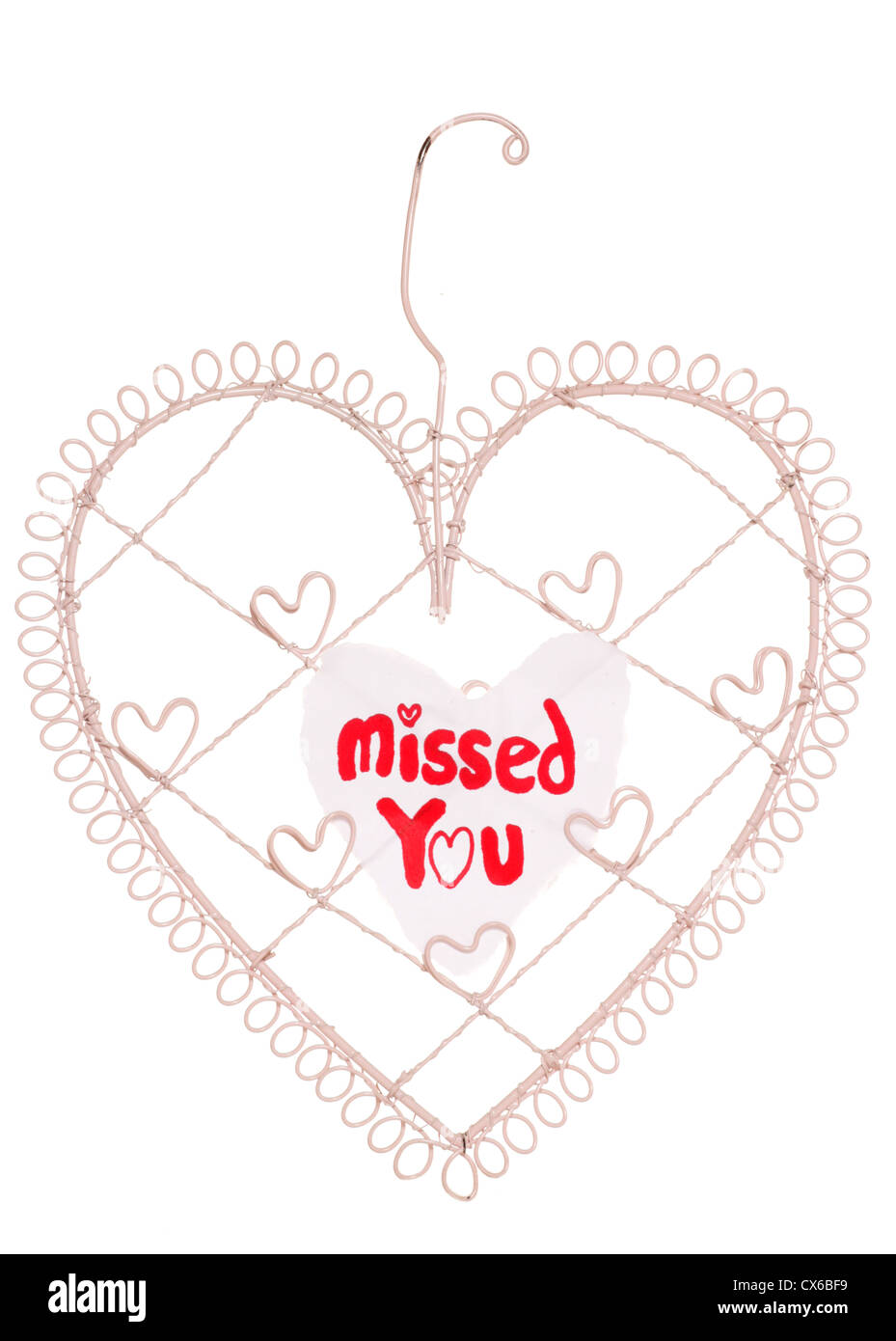 Missed you message on a heart note board studio cutout Stock Photo