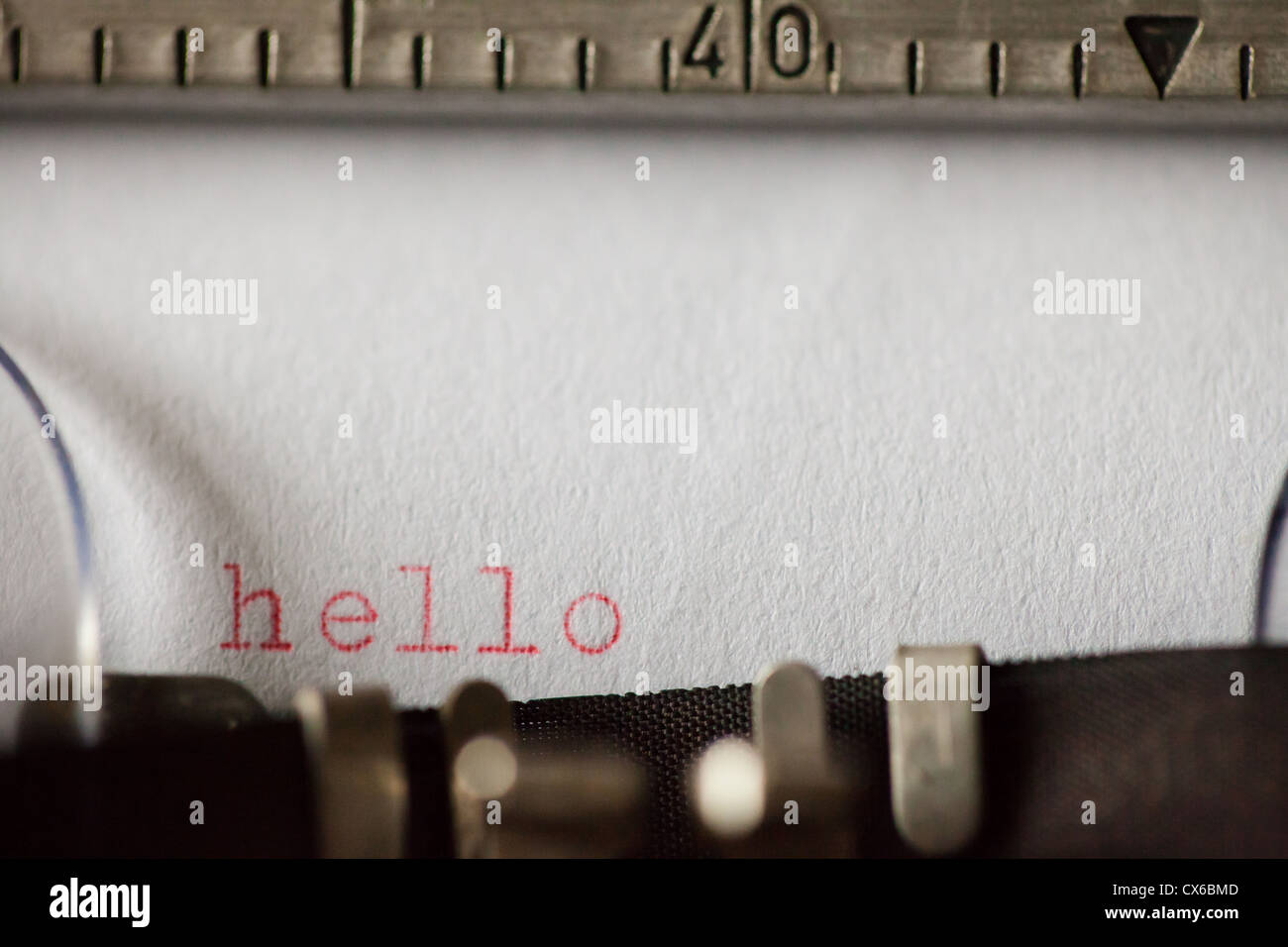 hello typed on an old typewriter in red ink Stock Photo - Alamy