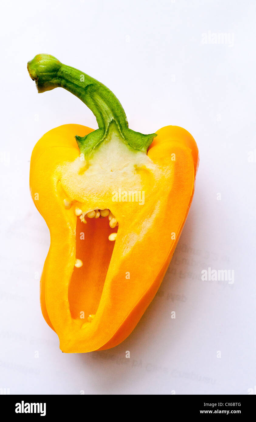 Half a yellow pepper on a white piece of paper Stock Photo