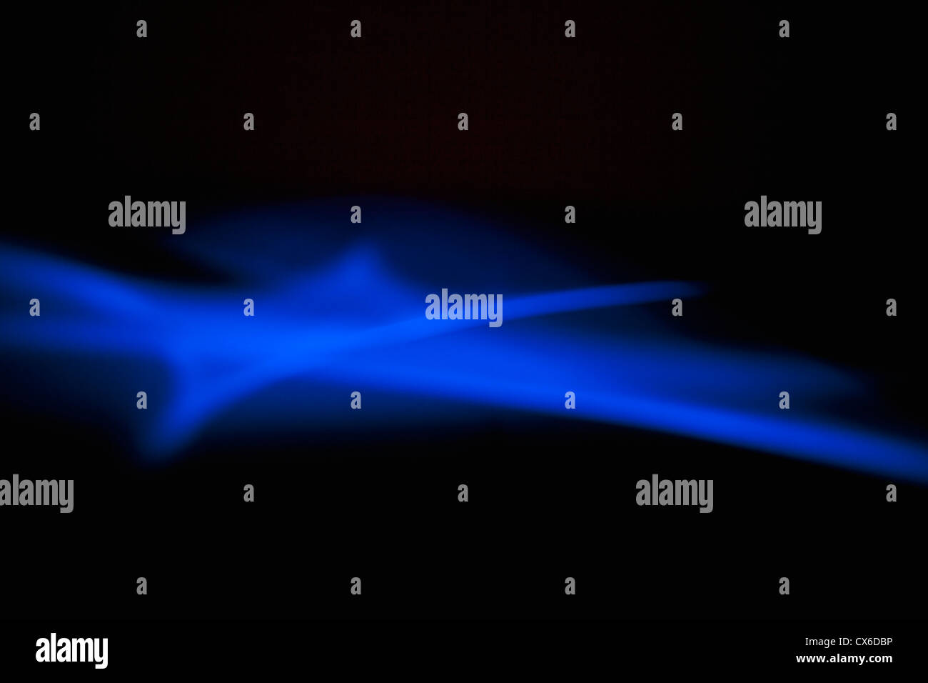 Blue light creating an ethereal effect on a black background Stock Photo