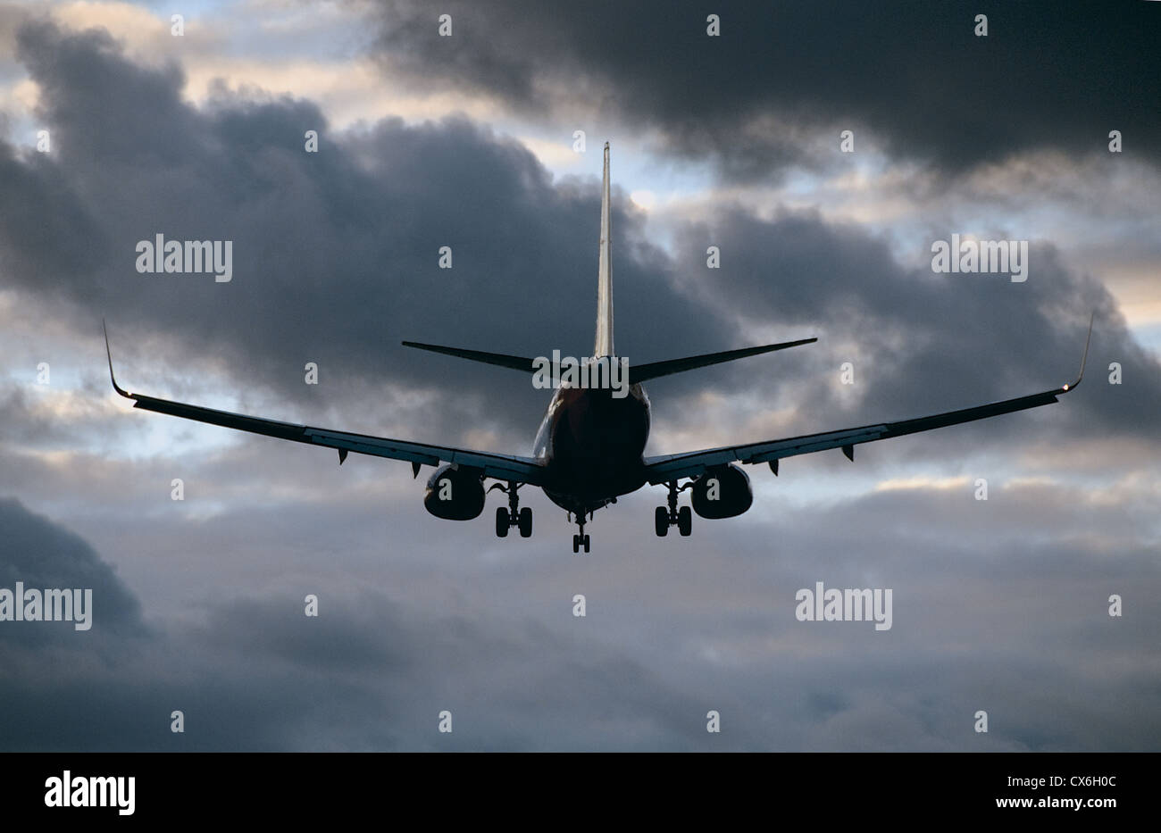 Airplane landing with cloudy sky McCarran International Airport in Las Vegas, Nevada Stock Photo