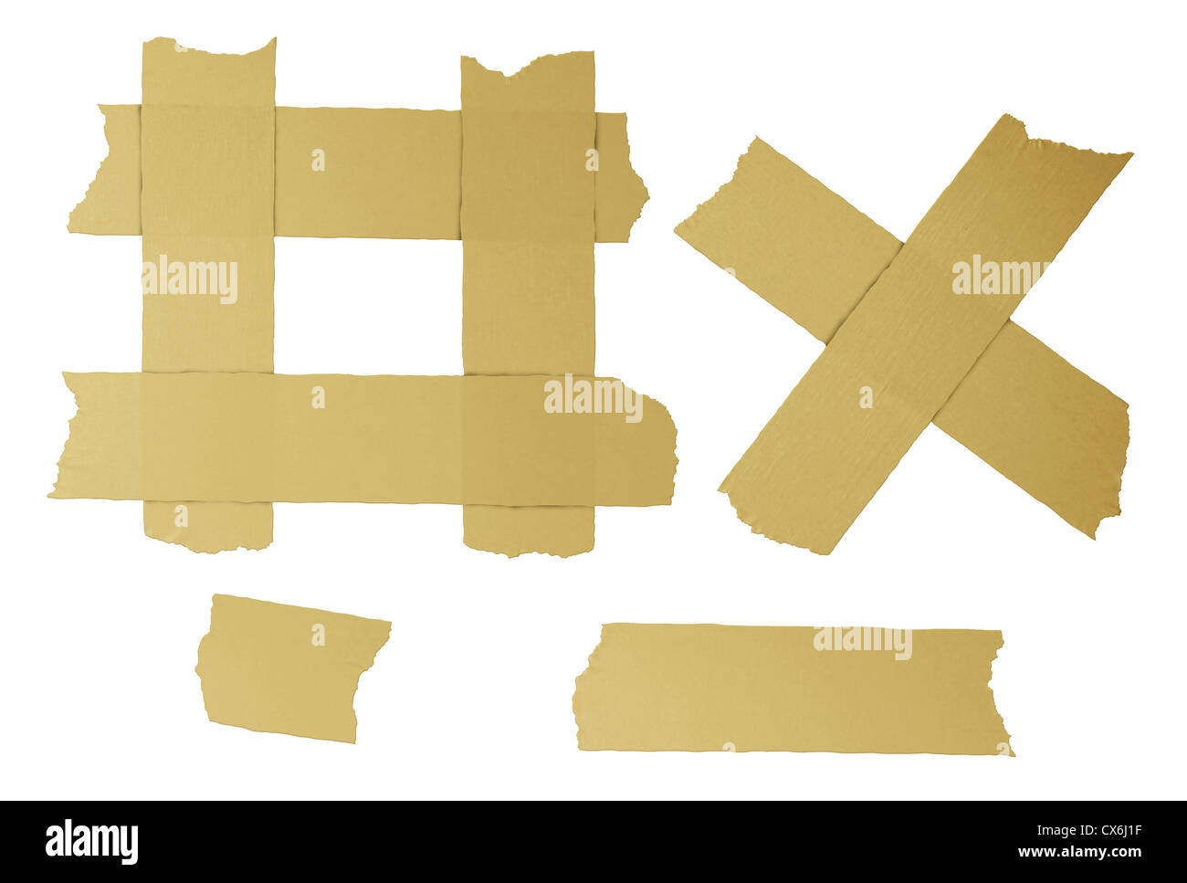 Masking tape torn strips of isolated elements of strong adhesive beige paper material asa office supplies used in packaging boxes or repairing or fixing broken things that need to be sealed air tight. Stock Photo