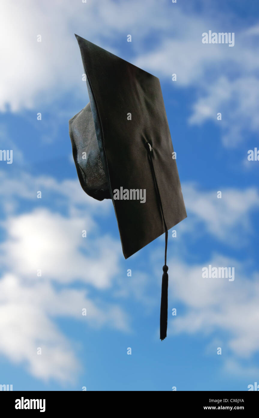 Graduation cap falling from the sky Stock Photo Alamy