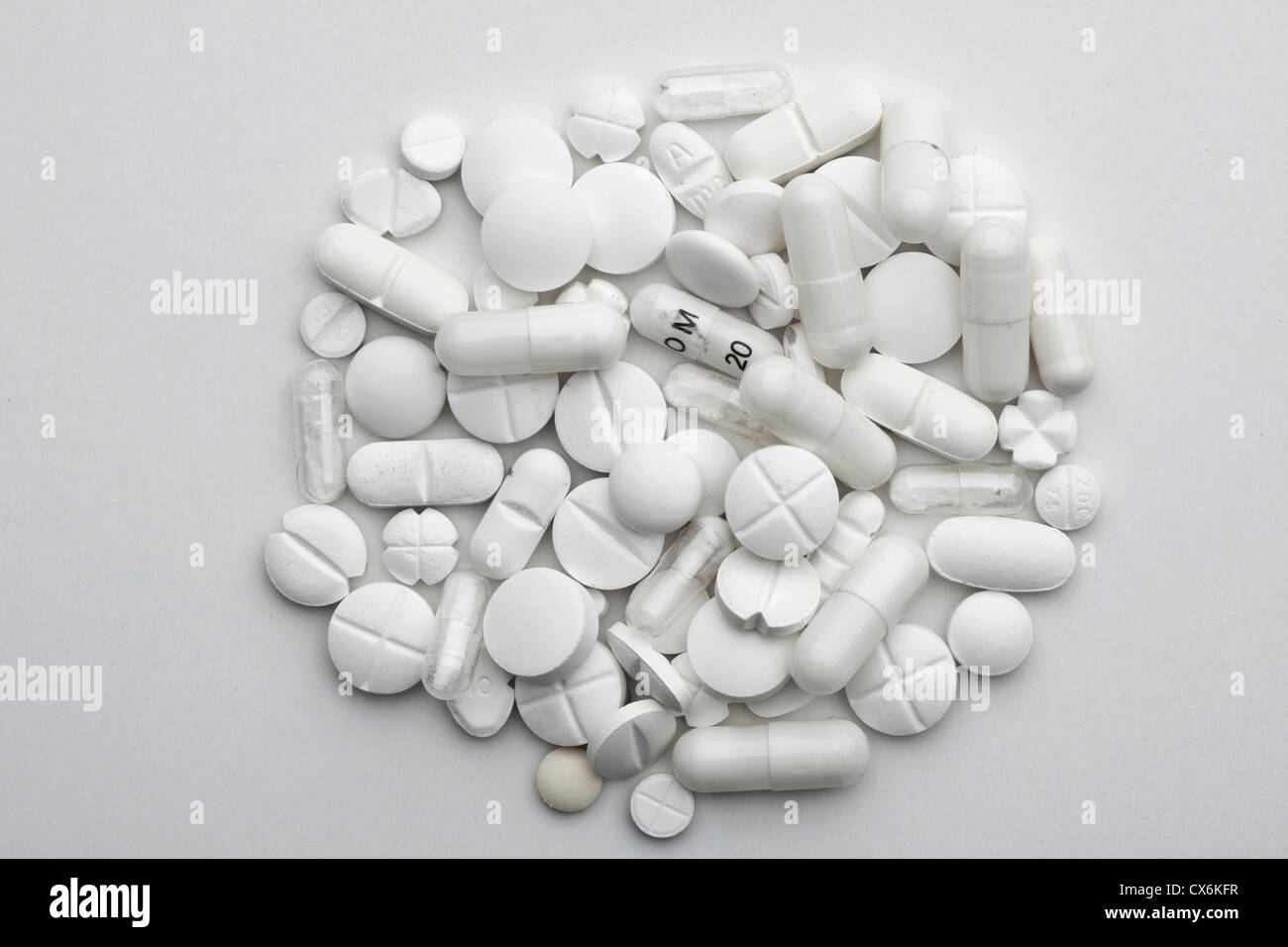 A heap of various white pills and capsules Stock Photo
