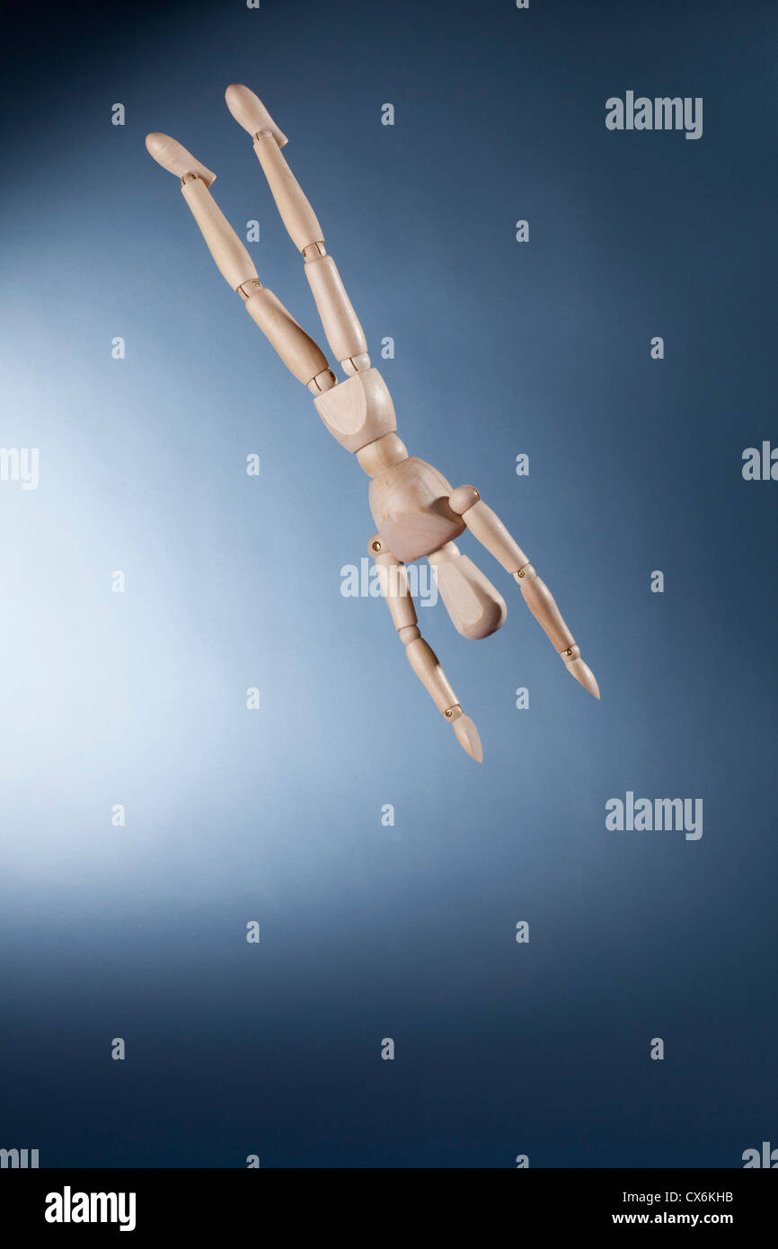 An upside down artist's figure falling in mid-air Stock Photo