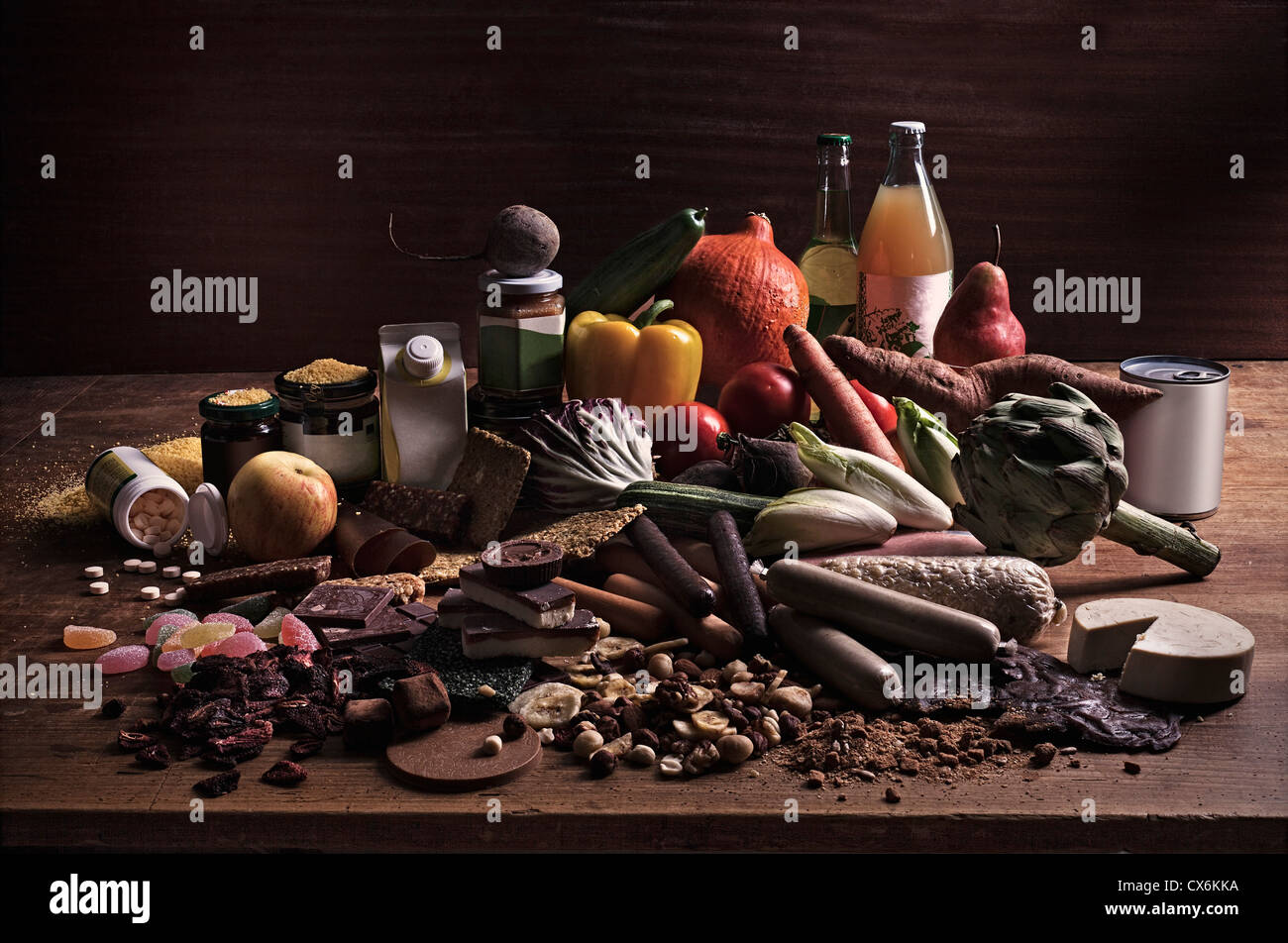 A variety of fresh and processed foods in a heap on a table Stock Photo