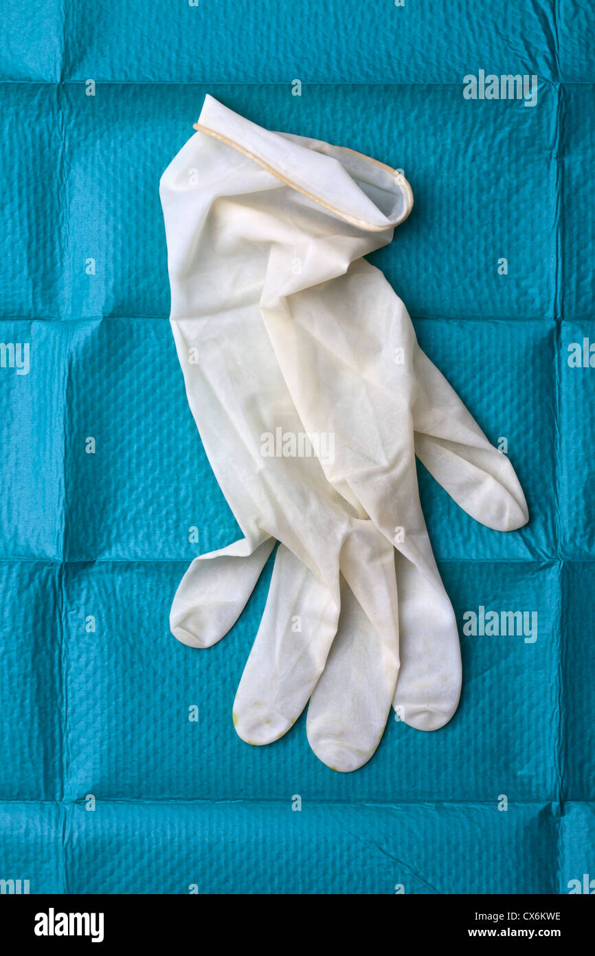 A surgical glove on a surgical drape Stock Photo