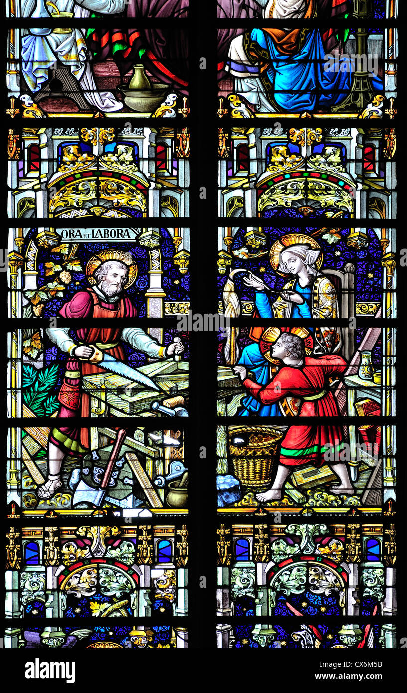 Mechelen (Malines), Belgium. Sint Romboutskathedraal / cathedral. Stained Glass Window. Joseph and Jesus doing Carpentry Stock Photo