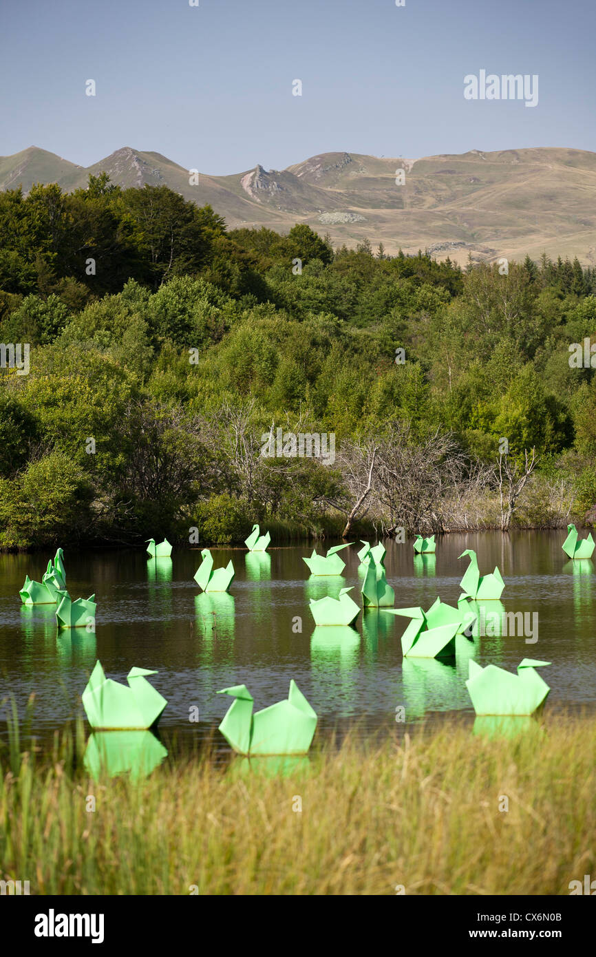 The Land Art work called 'Origamis', carried out by Antoine MILIAN, the French visual artist. Origami cranes and ducks. Stock Photo