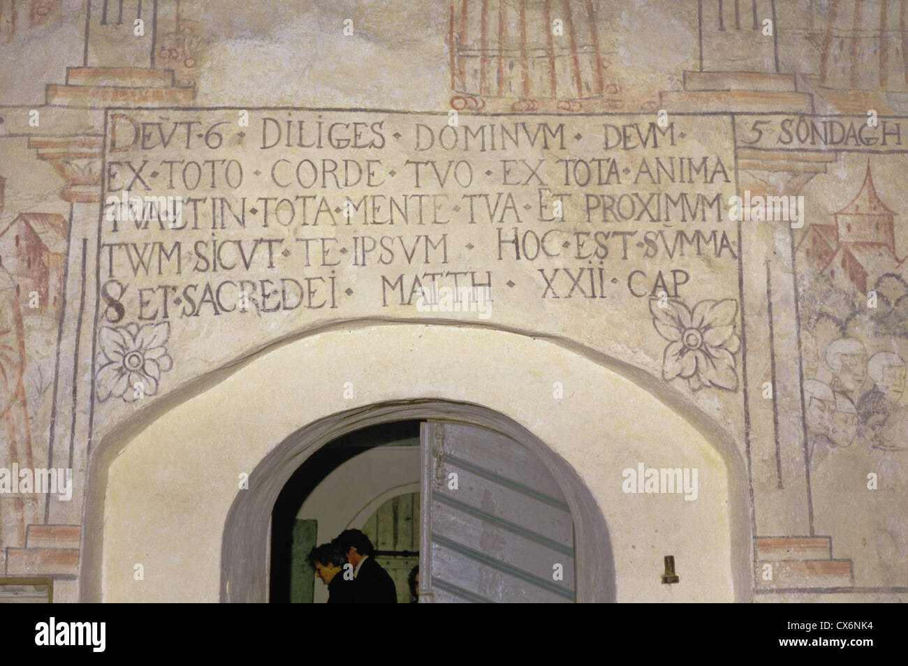 Latin text and wall murals in the medieval St. Lawrence Church of Isokyro, Finland Stock Photo