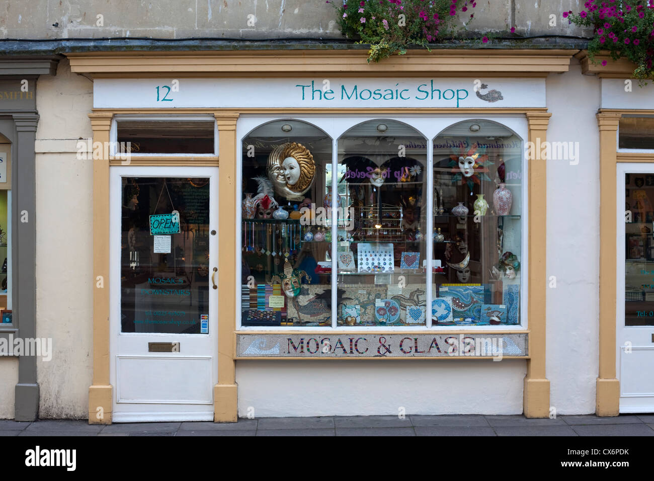 mosaic and glass shop front displaying goods for sale Stock Photo