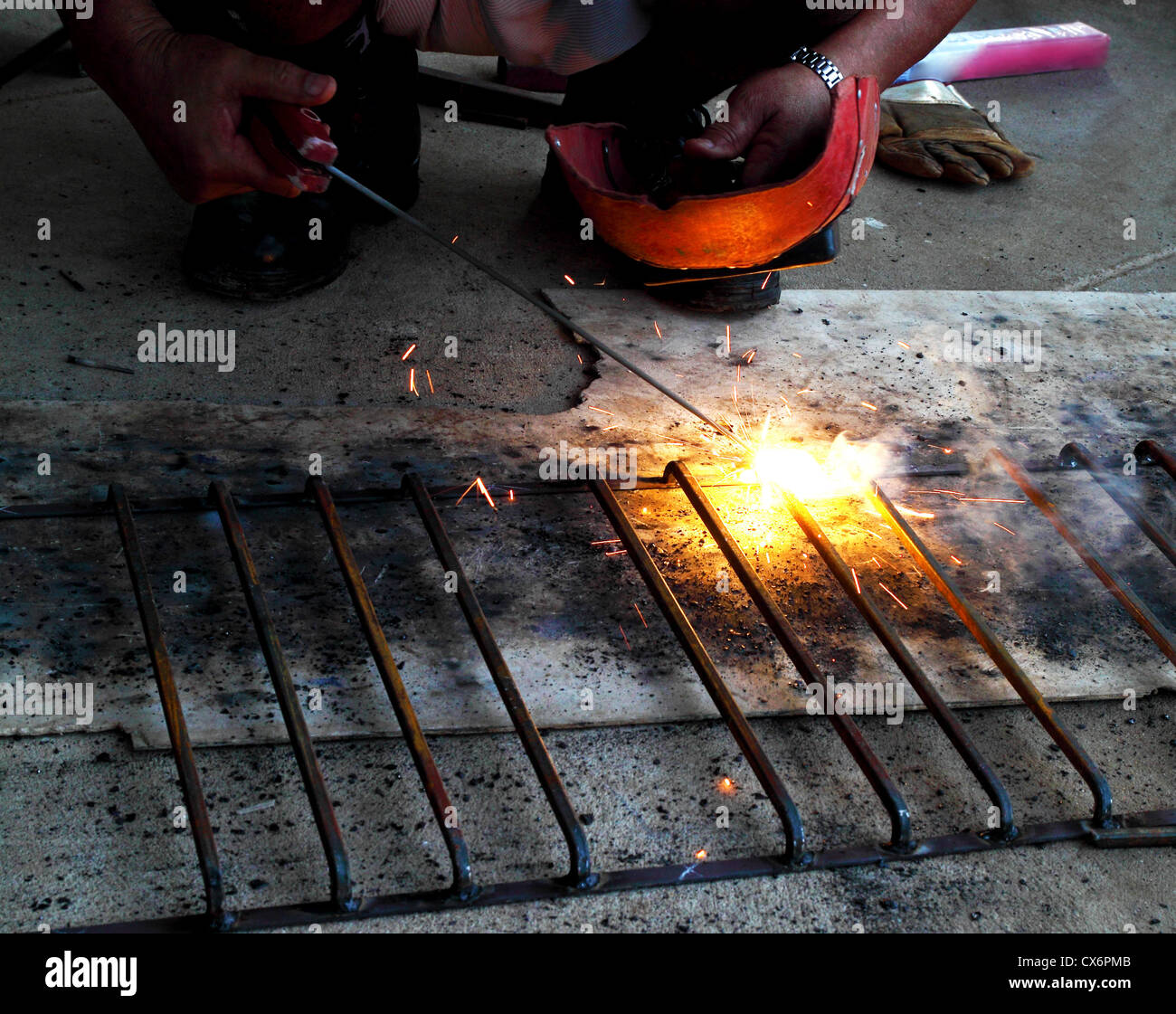 worker welding connecting square bar without gloves Stock Photo Alamy
