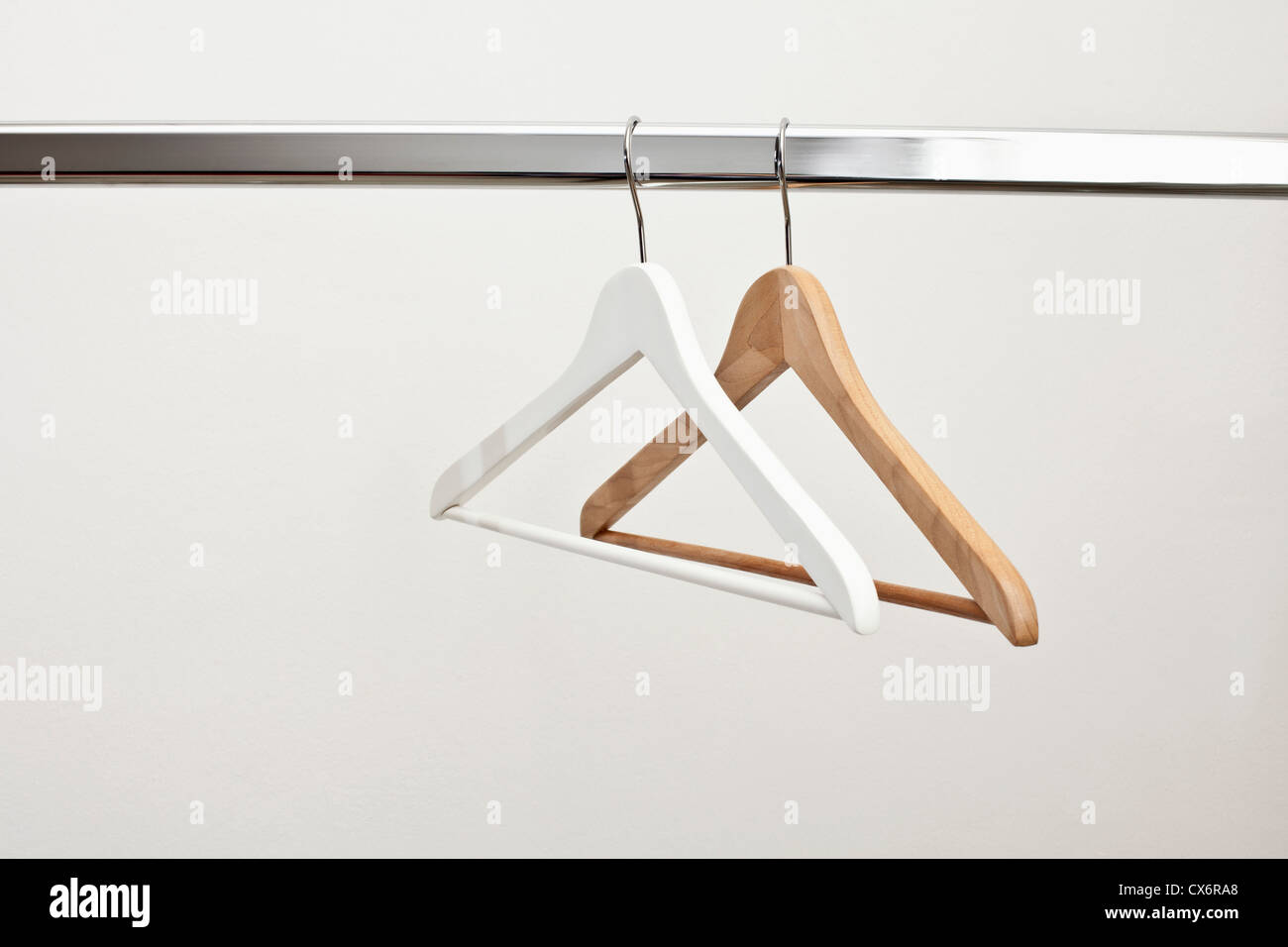 Clothes On Hang Rail, Isolated On White Background Stock Photo, Picture and  Royalty Free Image. Image 14574335.