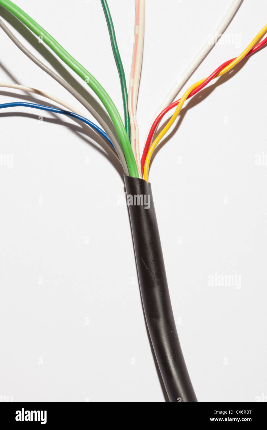A cable with different colored exposed wires spreading out from it Stock Photo