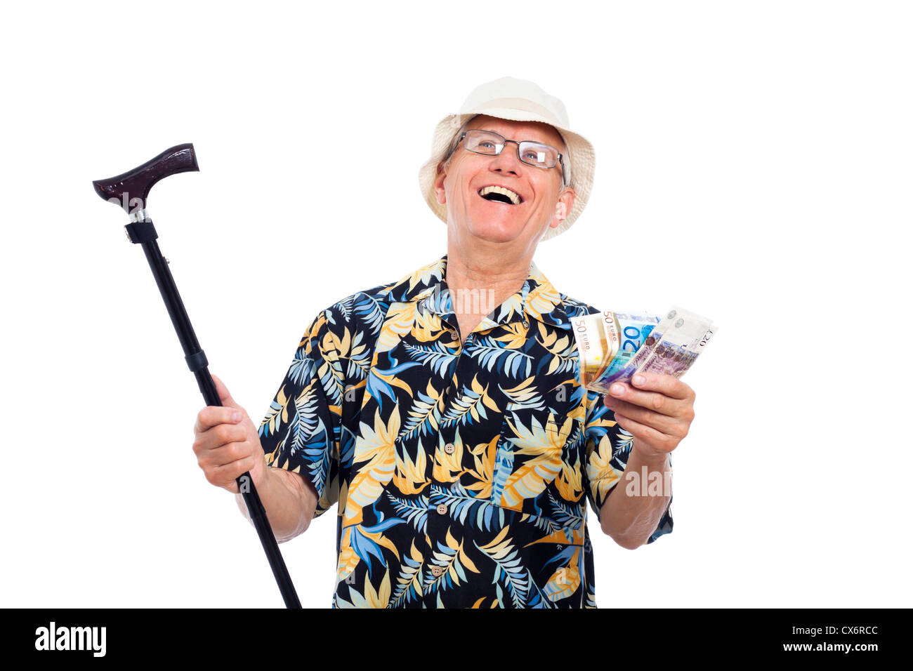Happy excited wealthy senior man holding money and cane, isolated on white background. Stock Photo
