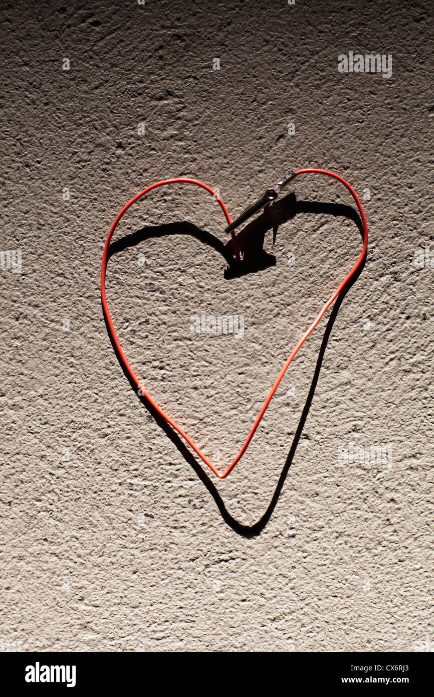 A red wire bent into the shape of heart Stock Photo