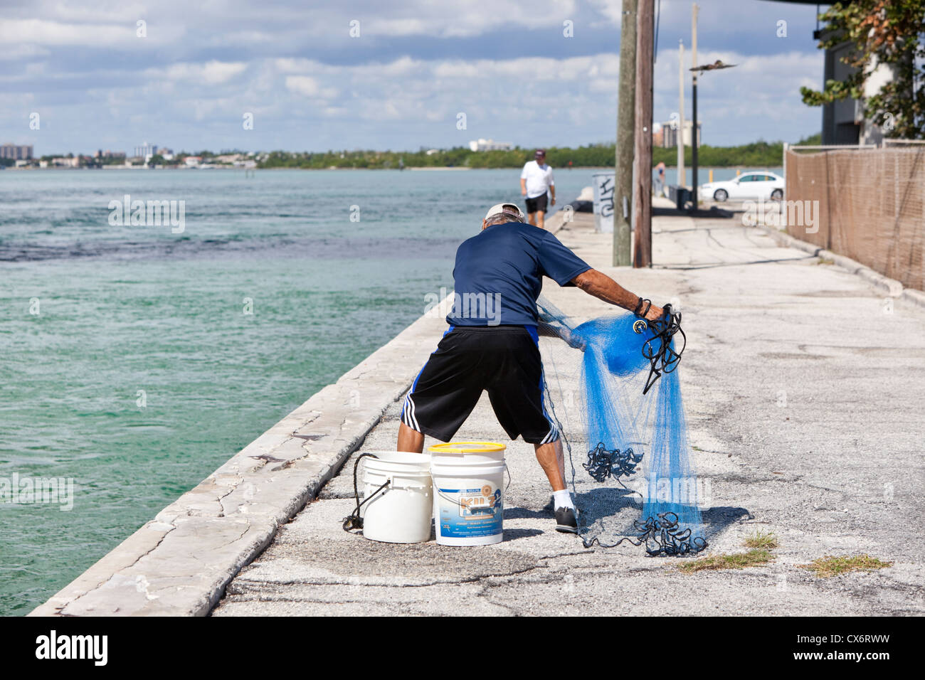 Fisherman ready to throw cast net into sea, Haulover Park Bayside Stock