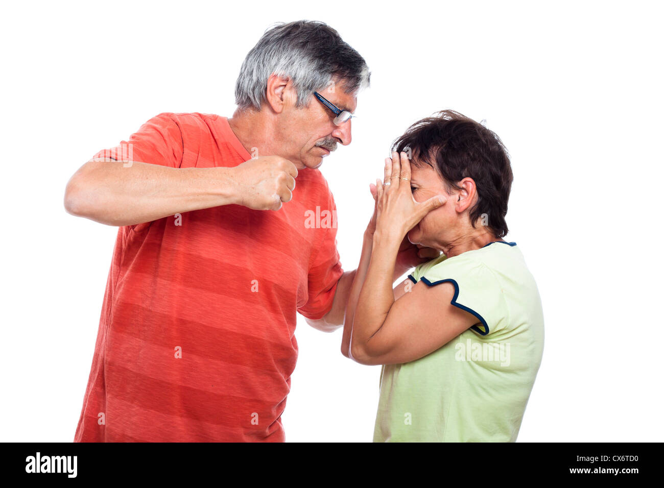 Domestic violence abuse concept, aggressive man going to punch unhappy woman, isolated on white background. Stock Photo