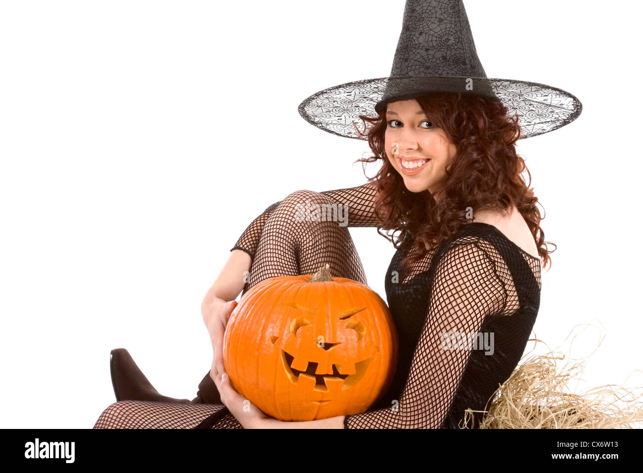 Portrait of Hispanic teenager girl in black Halloween fishnet
