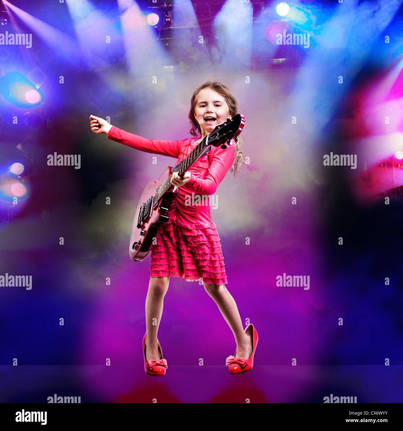 portrait of young girl with a guitar on the stage Stock Photo - Alamy