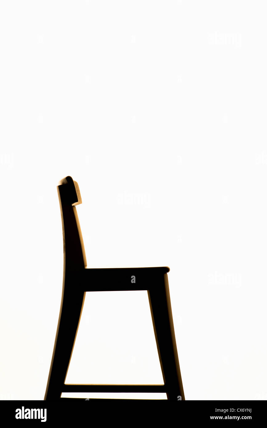 Side view of empty wooden chair on white background Stock Photo