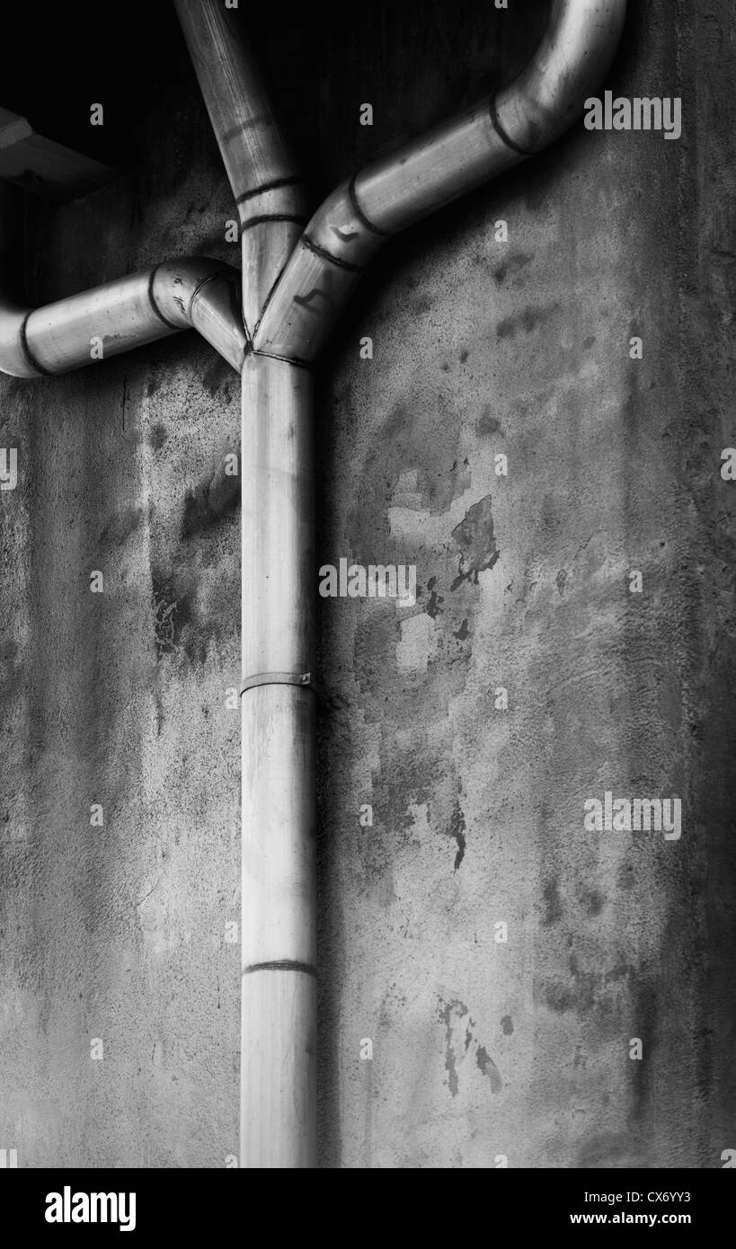 Connected piping in urban setting Stock Photo