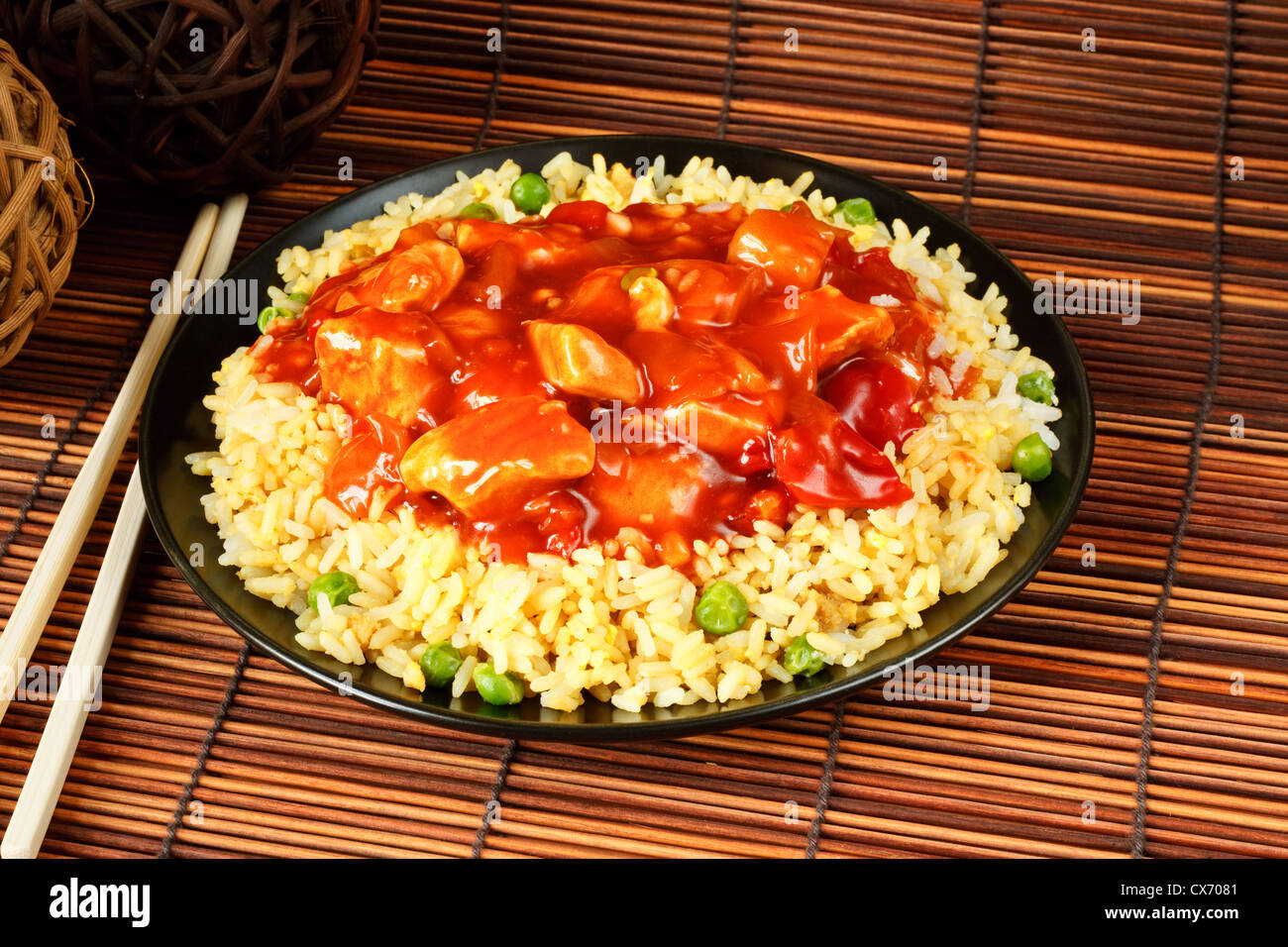 sweet and sour chicken with fried rice - popular chinese cuisine Stock Photo