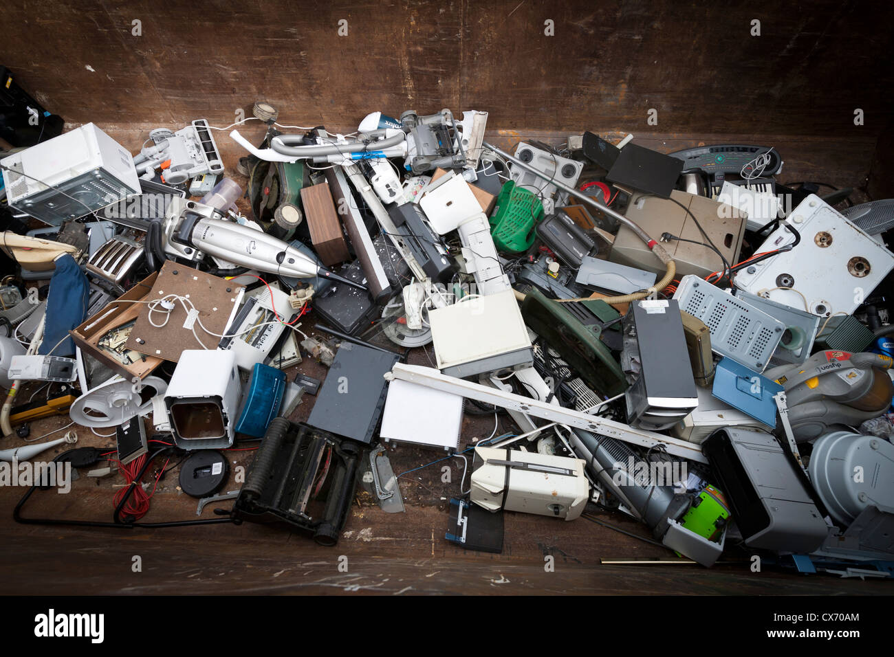 Electrical appliances piled in the bottom of a skip Stock Photo Alamy
