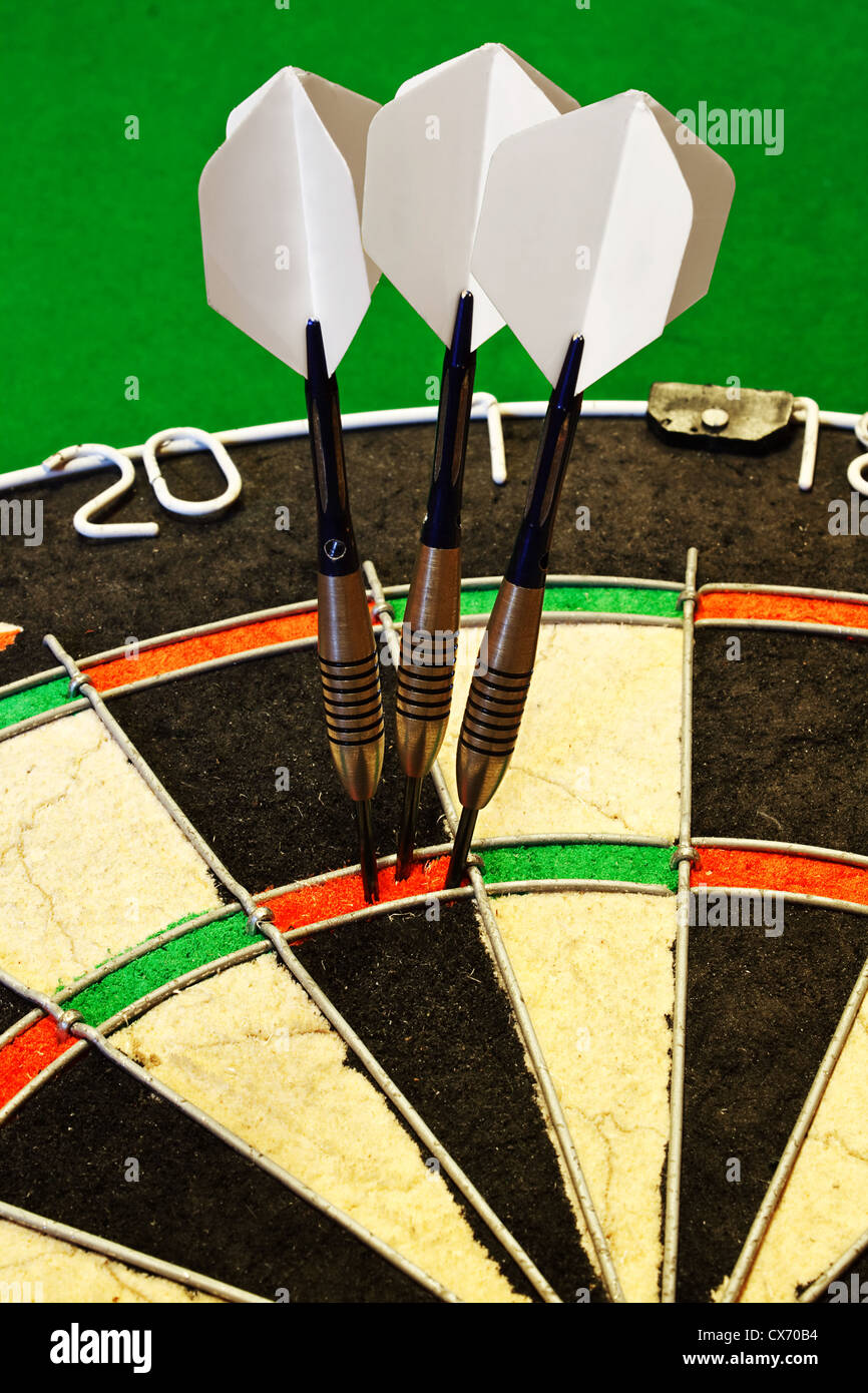 Three Darts Successfully Scoring One Hundred And Eighty In A Dartboard CX70B4 