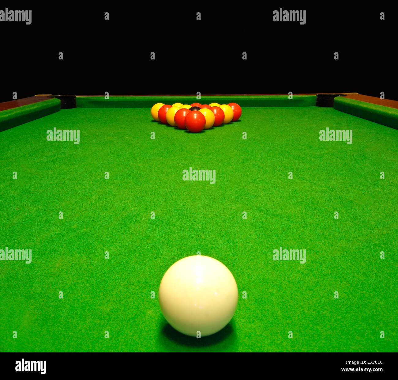 A green cloth billiards or pool table with english league red and yellow  balls Stock Photo - Alamy