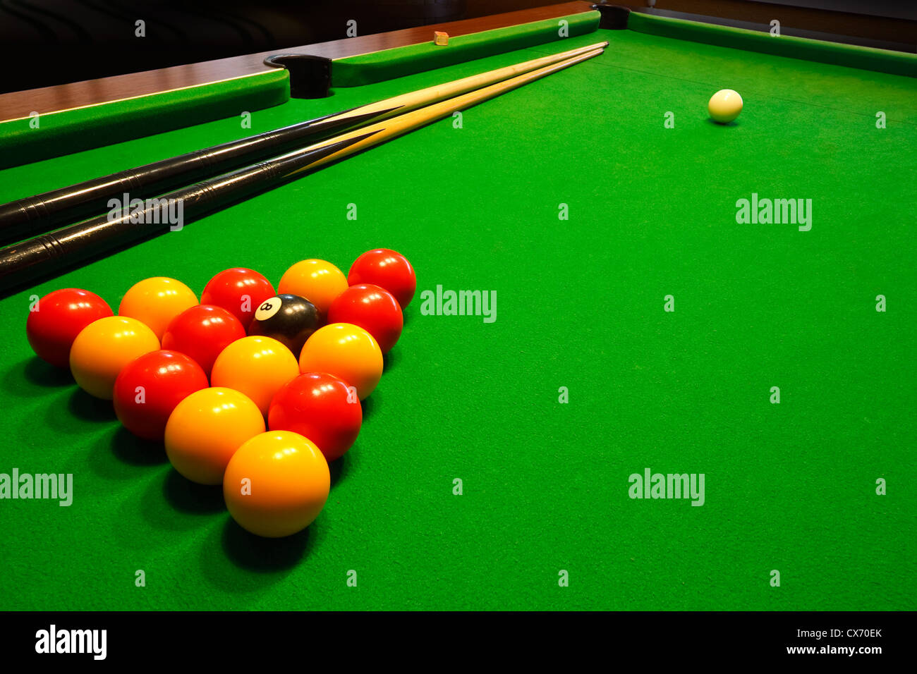 A green cloth billiards or pool table with english league red and yellow  balls Stock Photo - Alamy