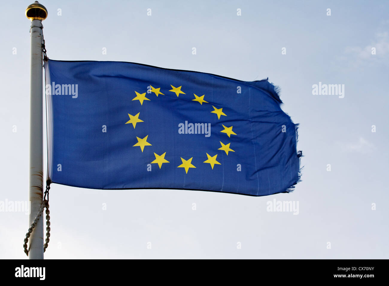 The European union flag of europe ripples in the wind on flagpole Stock Photo